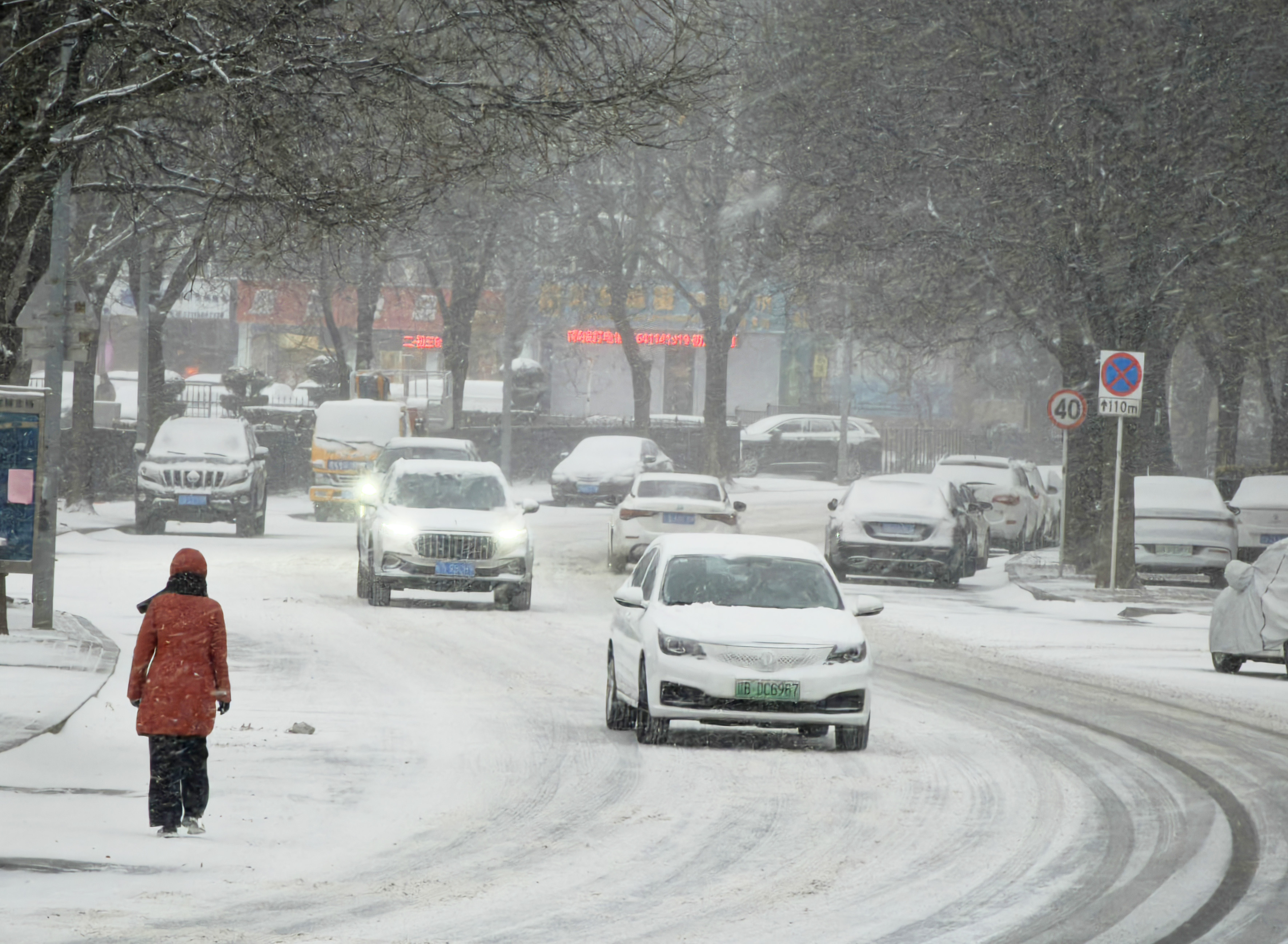 Cars drive in snow on January 27, 2025, in Dalian, China. | Source: Getty Images