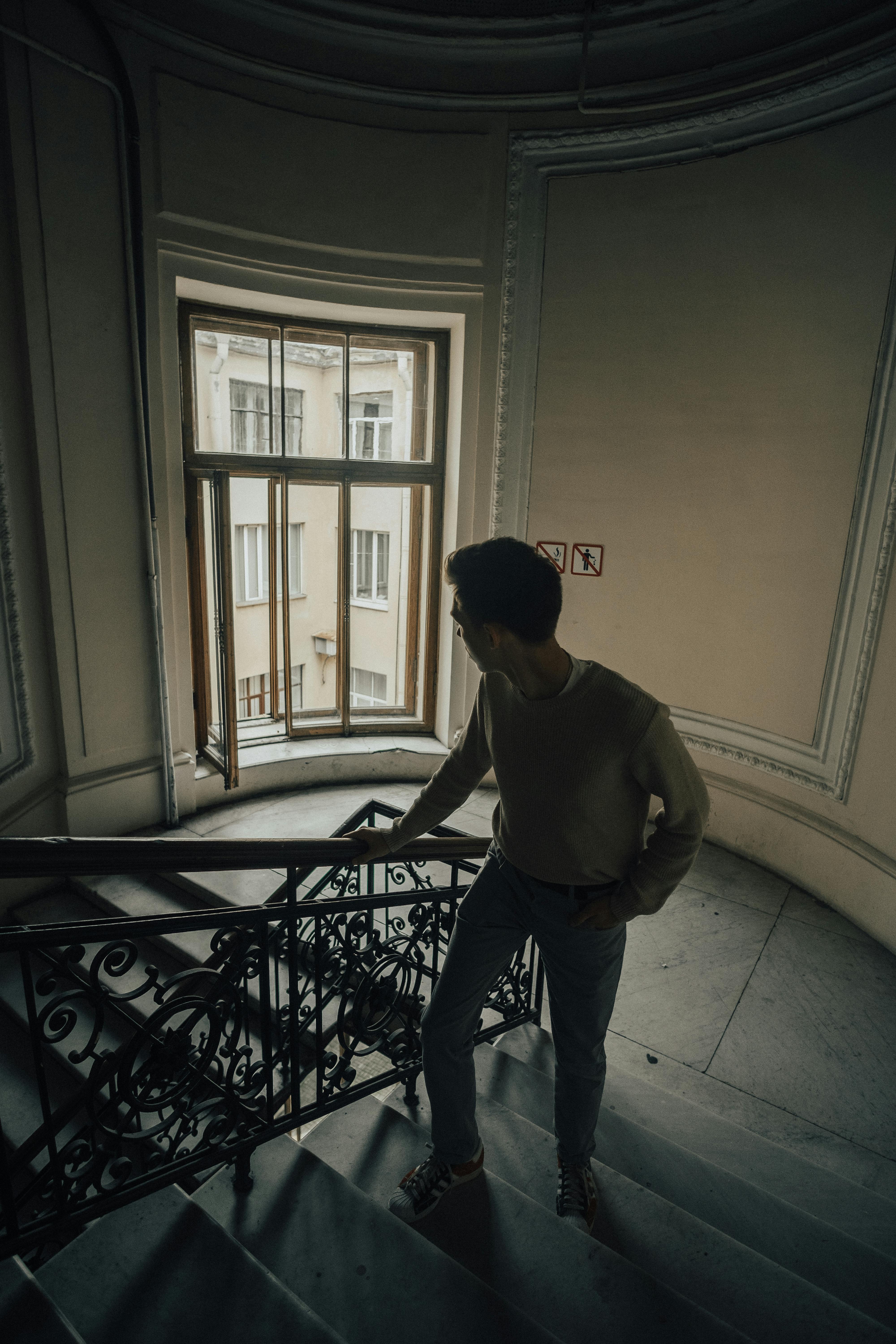 A  man walking up stairs | Source: pexels