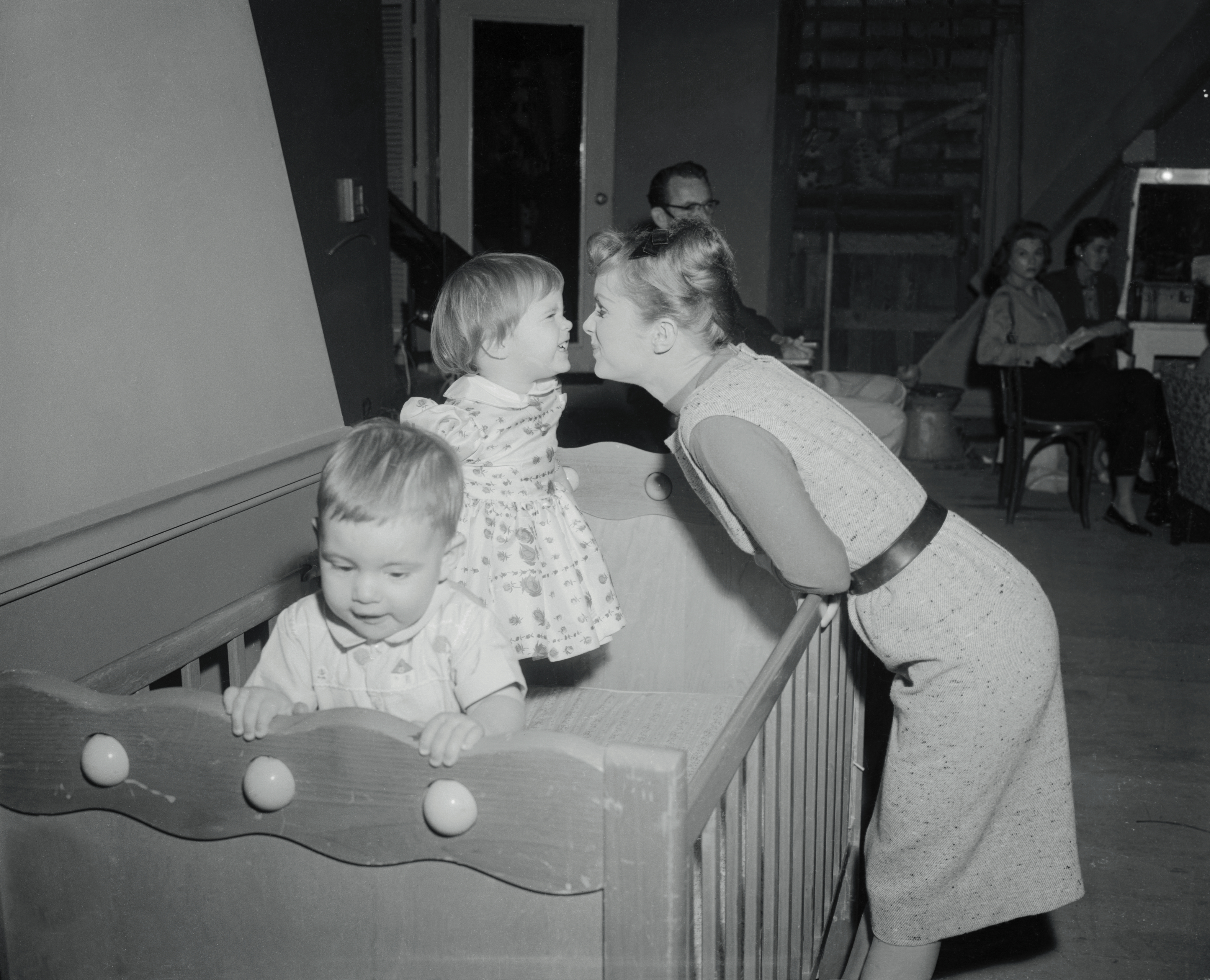 Debbie Reynolds playing with her children on the set of "Say One for Me." | Source: Getty Images
