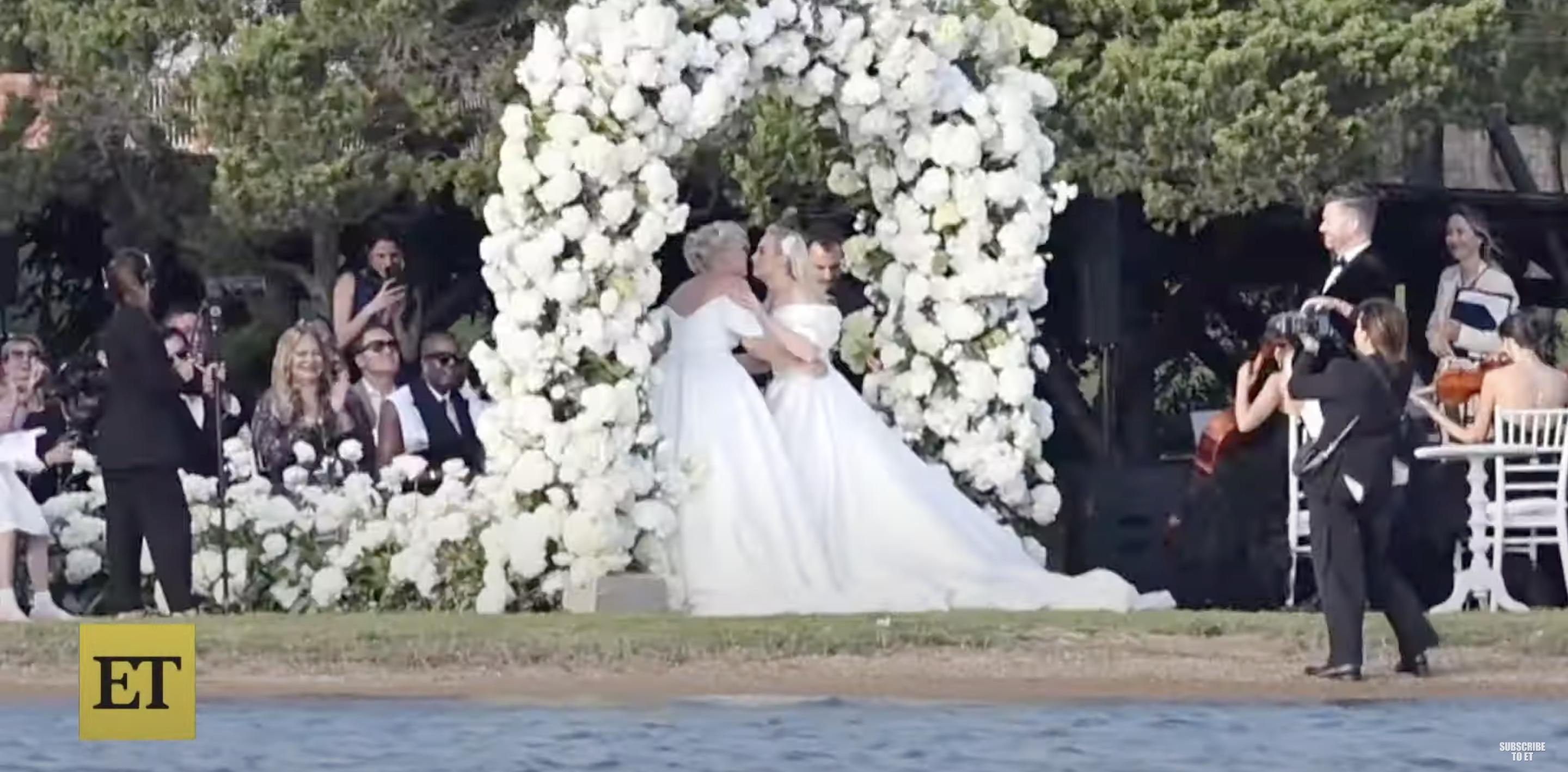 Rebel Wilson and Ramona Agruma sealing their vows with a kiss on their wedding day posted on October 1, 2024 | Source: YouTube/@EntertainmentTonight