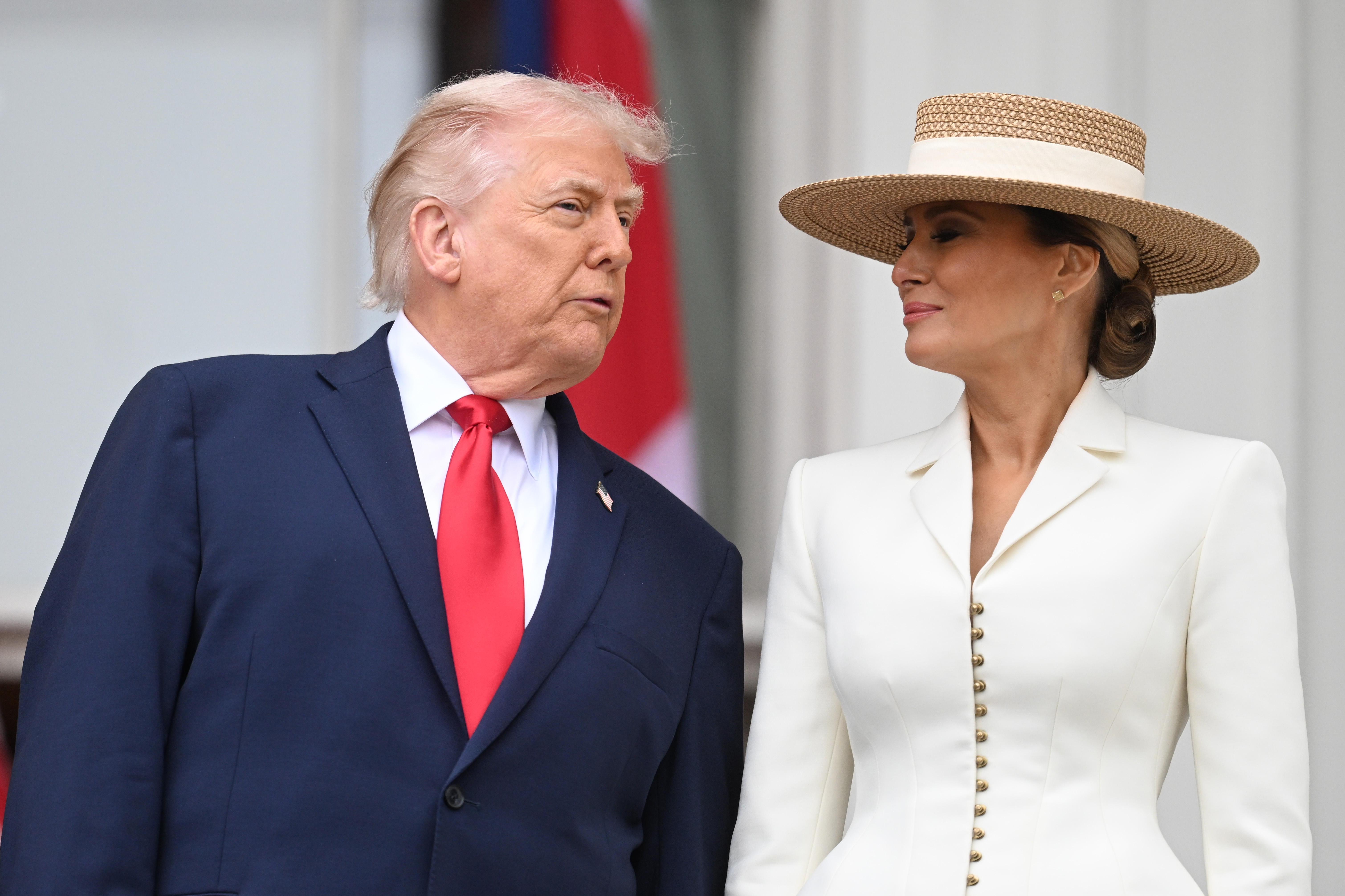 Donald Trump and Melania Trump pose on the balcony of the White House during a state arrival ceremony on the South Lawn on day two of the State Visit of King Charles III and Queen Camilla to the United States of America on April 28, 2026, in Washington, DC | Source: Getty Images
