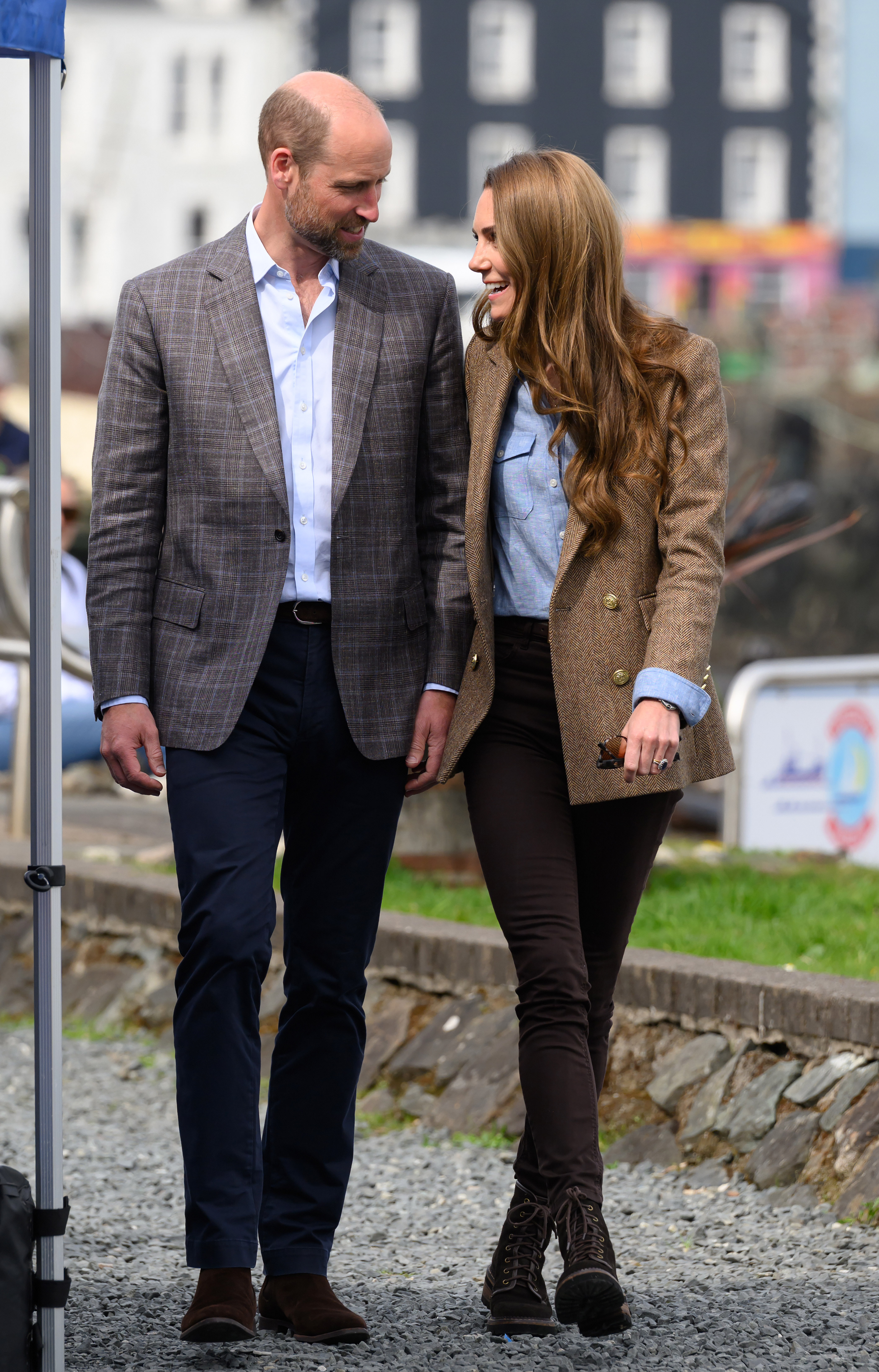 William and Catherine stroll through Tobermory, exchanging smiles. Their coordinated attire and relaxed demeanor captured the attention of photographers and islanders alike during their two-day tour.