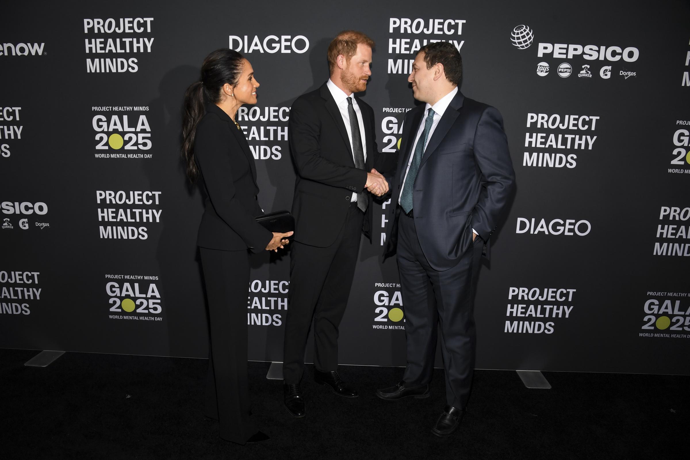 Meghan Markle, Prince Harry, and Phil Schermer at Project Healthy Minds' World Mental Health Day Festival at Spring Studios on October 9, 2025, in New York City | Source: Getty Images