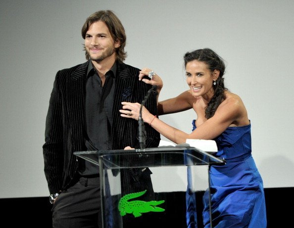 Ashton Kutcher (L) and Demi Moore speak onstage at the 13th Annual Costume Designers Guild Awards with presenting sponsor Lacoste held at The Beverly Hilton hotel on February 22, 2011, in Beverly Hills, California. | Source: Getty Images.
