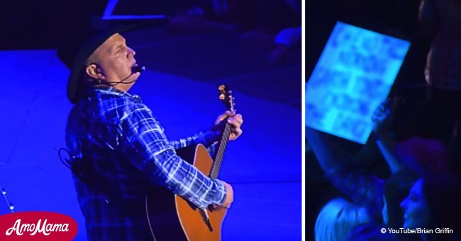 Garth Brooks stops a concert after seeing a woman's sign in the crowd