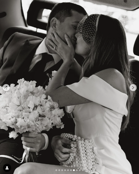 Tyrone Wood and Faye Harris sharing a kiss on their wedding day, posted on July 28, 2024 | Source: Instagram/fayeharriswood and tywoody1