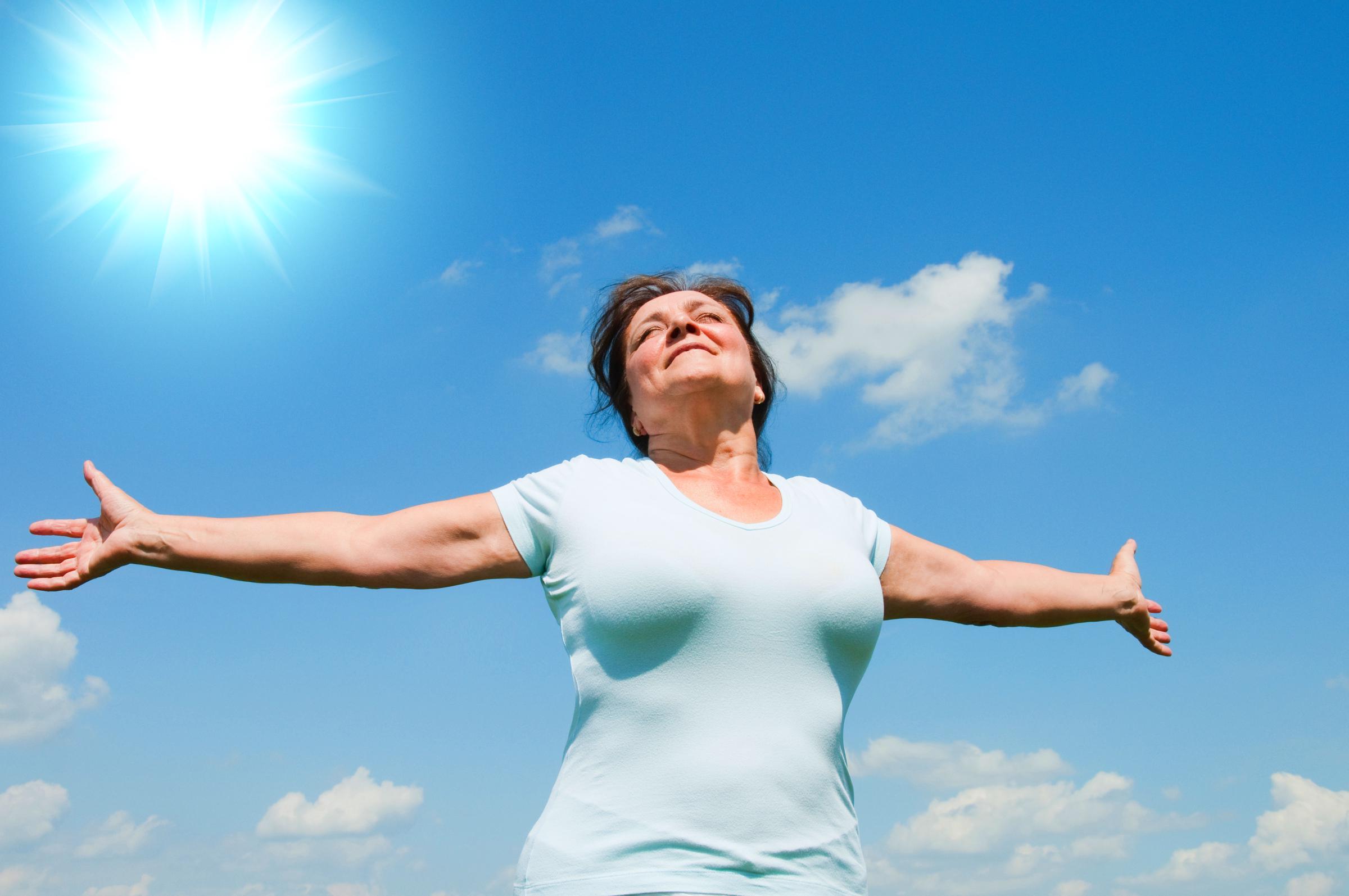 Woman relishing the sunshine | Source: Shutterstock