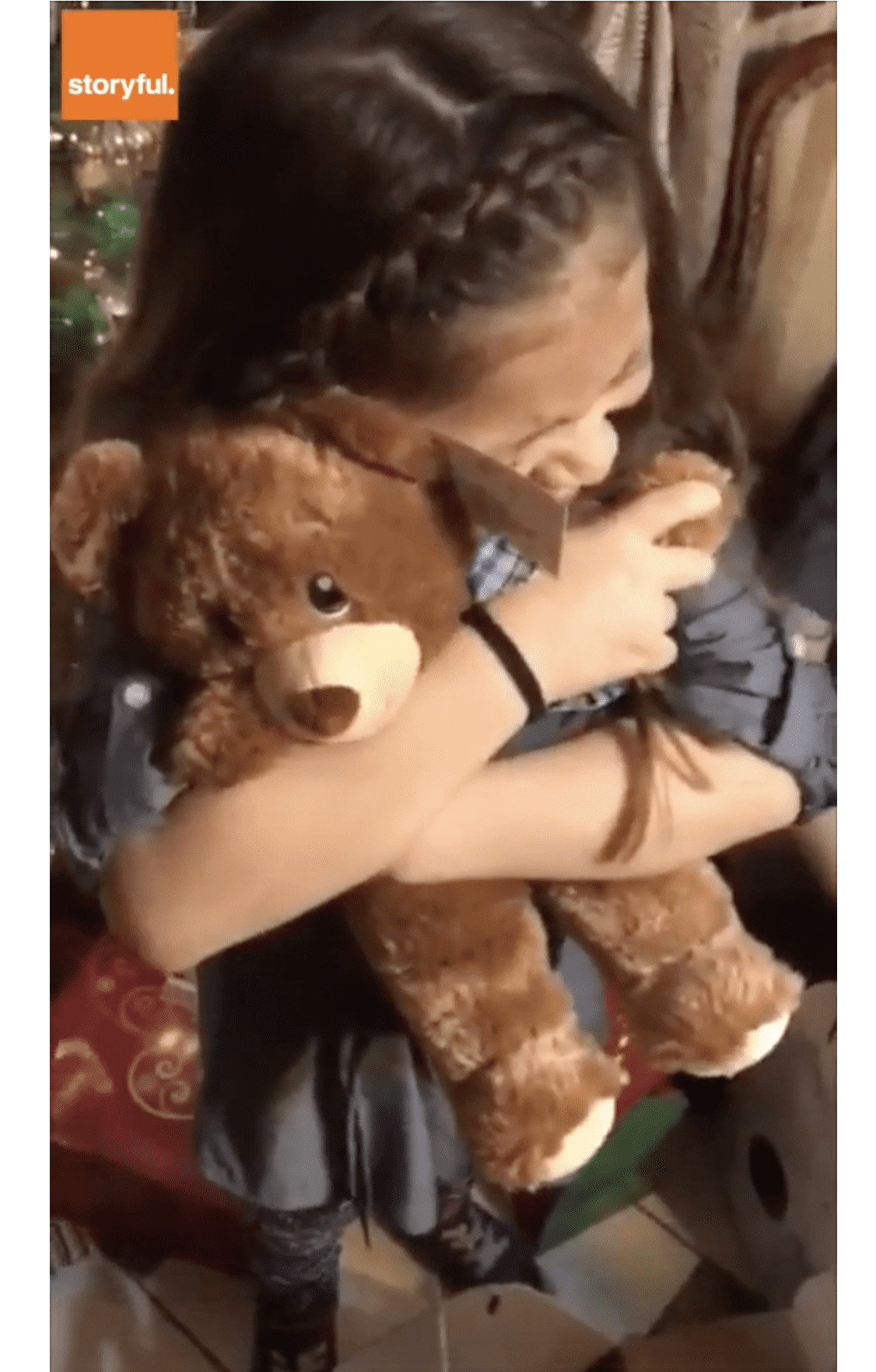 One of the sisters breaks down holding the teddy close to her chest. | Source: facebook.com/fox26houston