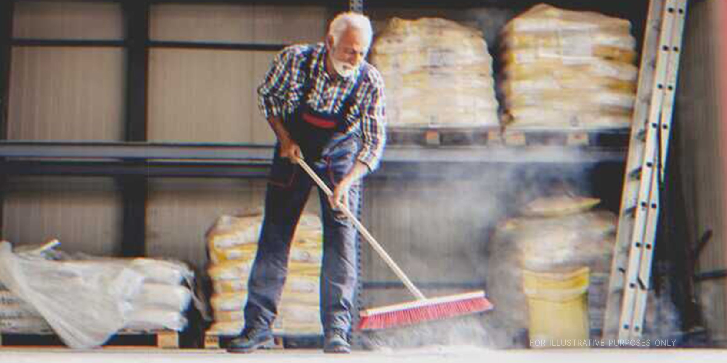 Old man sweeping with a broom. | Source: Shutterstock