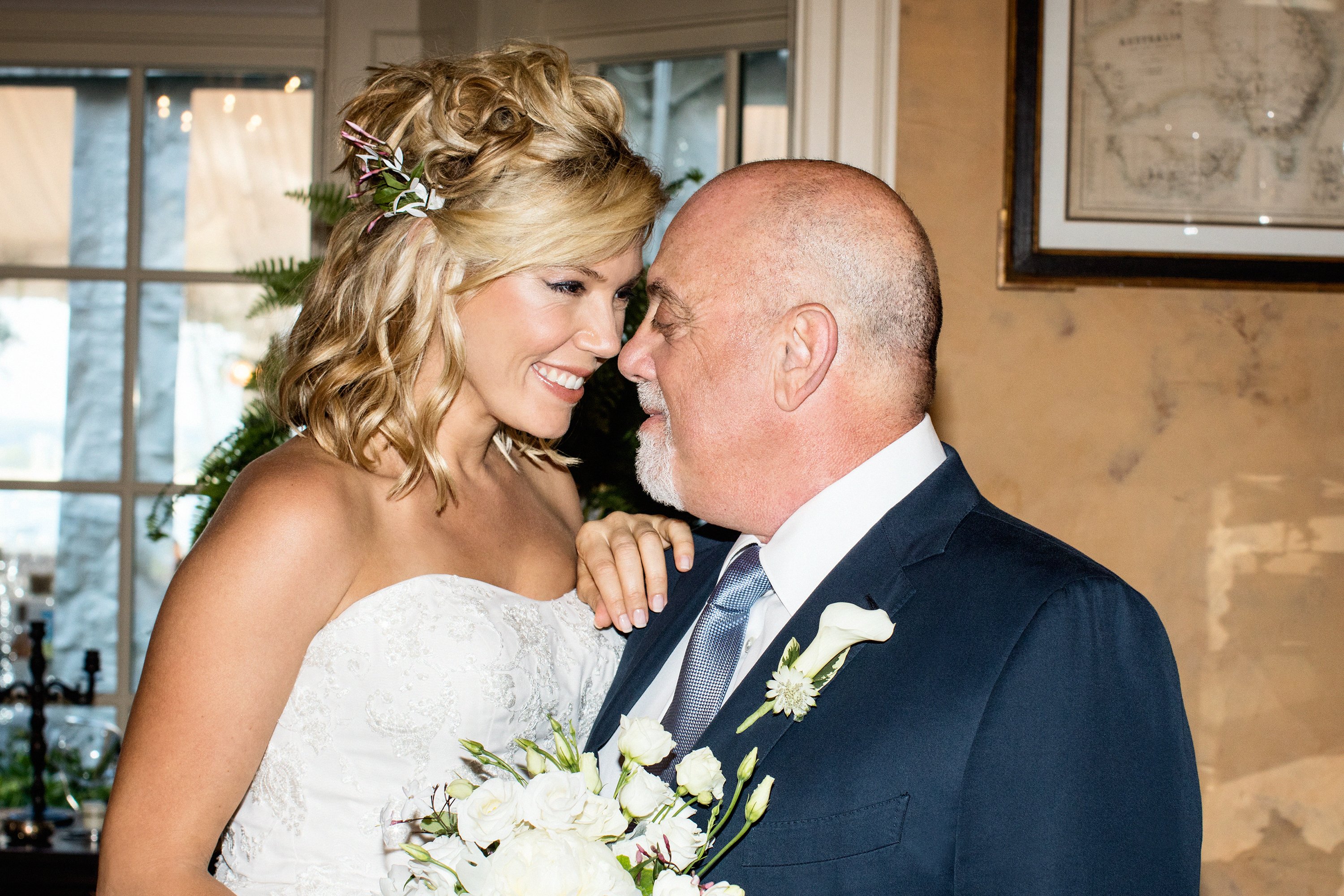 Newlyweds Billy Joel and Alexis Roderick during their surprise wedding ceremony held at their estate on July 4, 2015 in Long Island. / Source: Getty Images