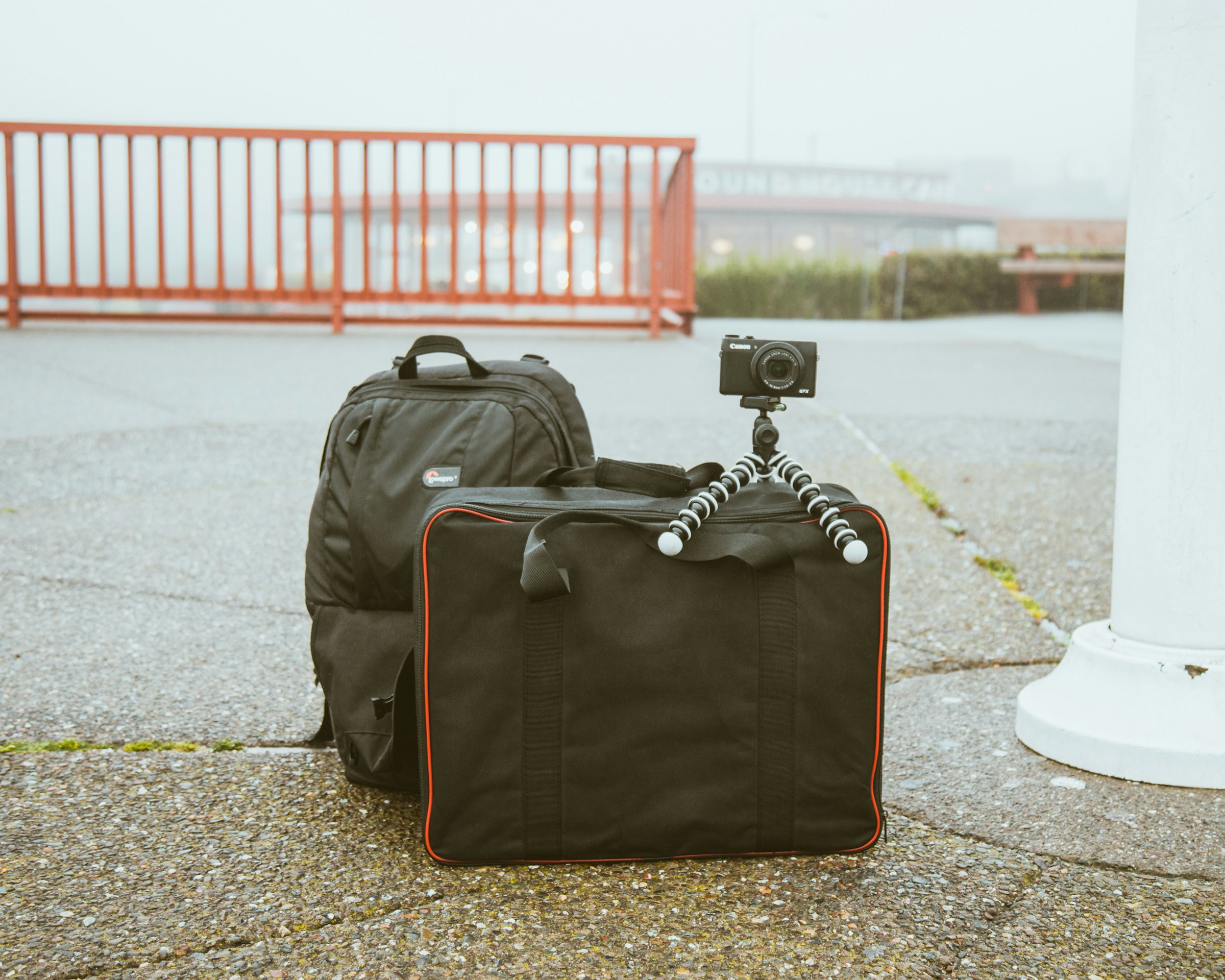 Packed bags with a camera | Source: Unsplash