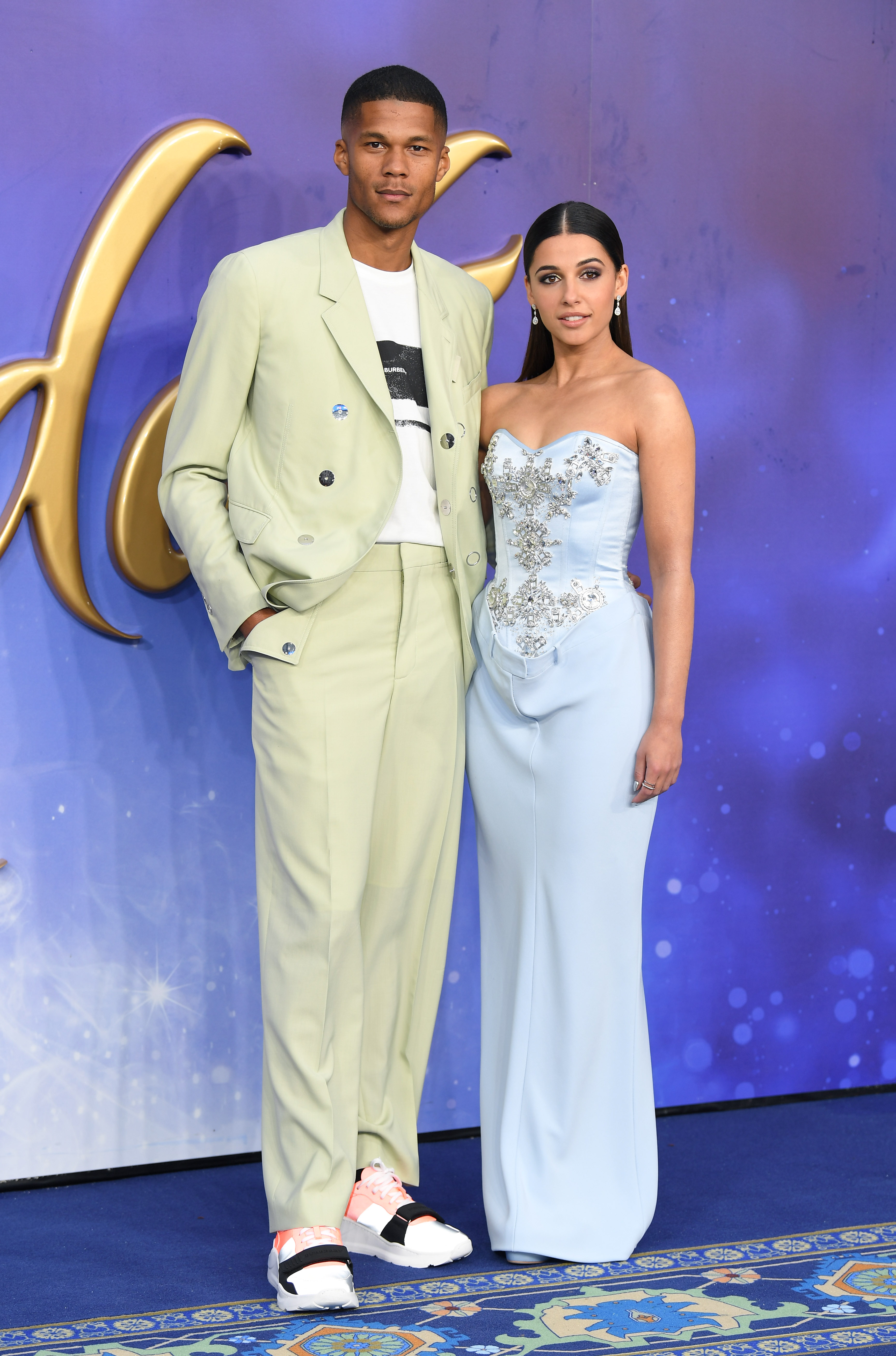 Jordan Spence and Naomi Scott pose at the "Aladdin" European Gala at Odeon Luxe Leicester Square on May 9, 2019, in London, England | Source: Getty Images