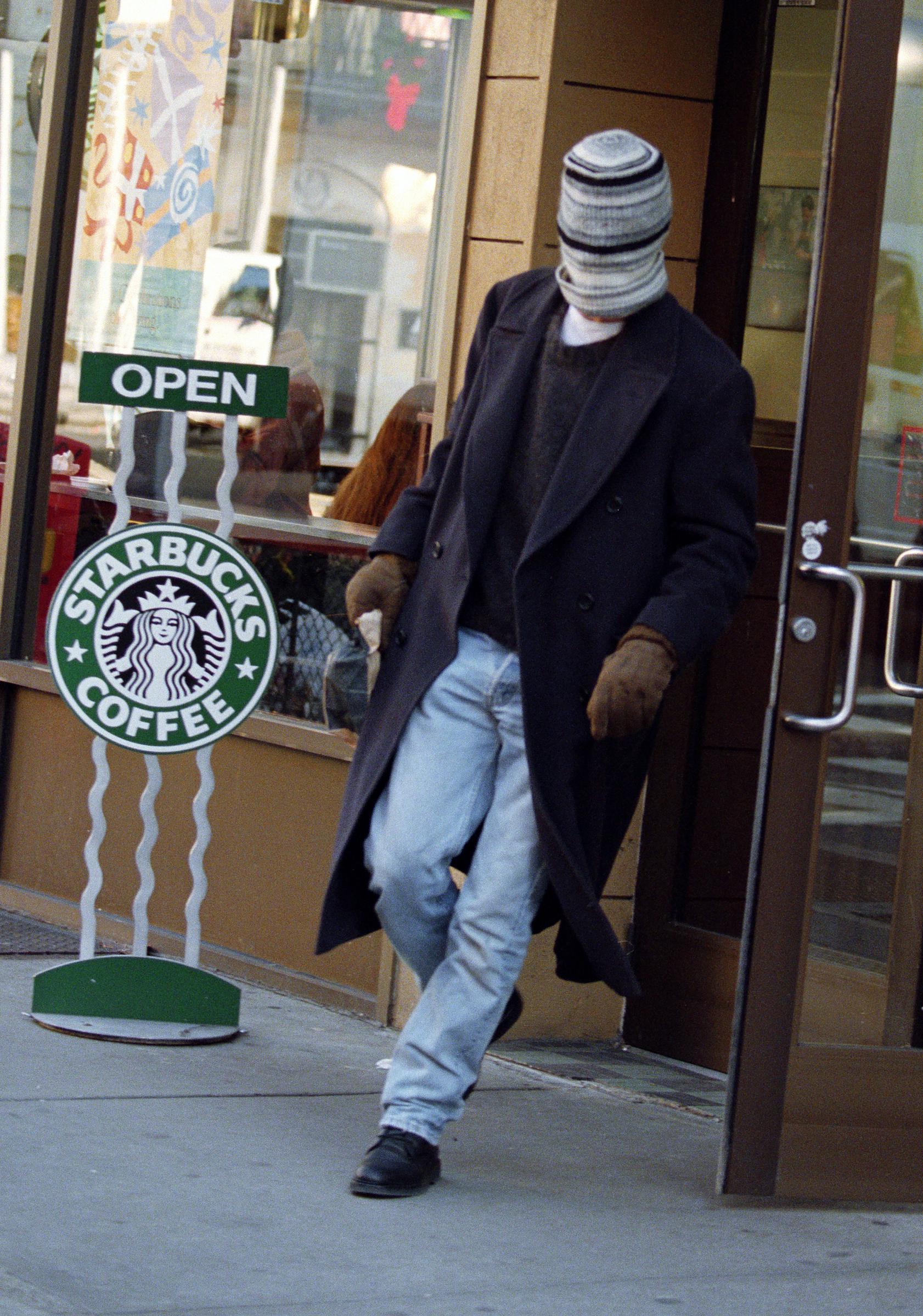 On December 11, 1995, Brad Pitt was spotted leaving a magazine shop on Lexington Avenue when he noticed photographers nearby. In a swift, almost theatrical move, he pulled his wool cap down over his face.