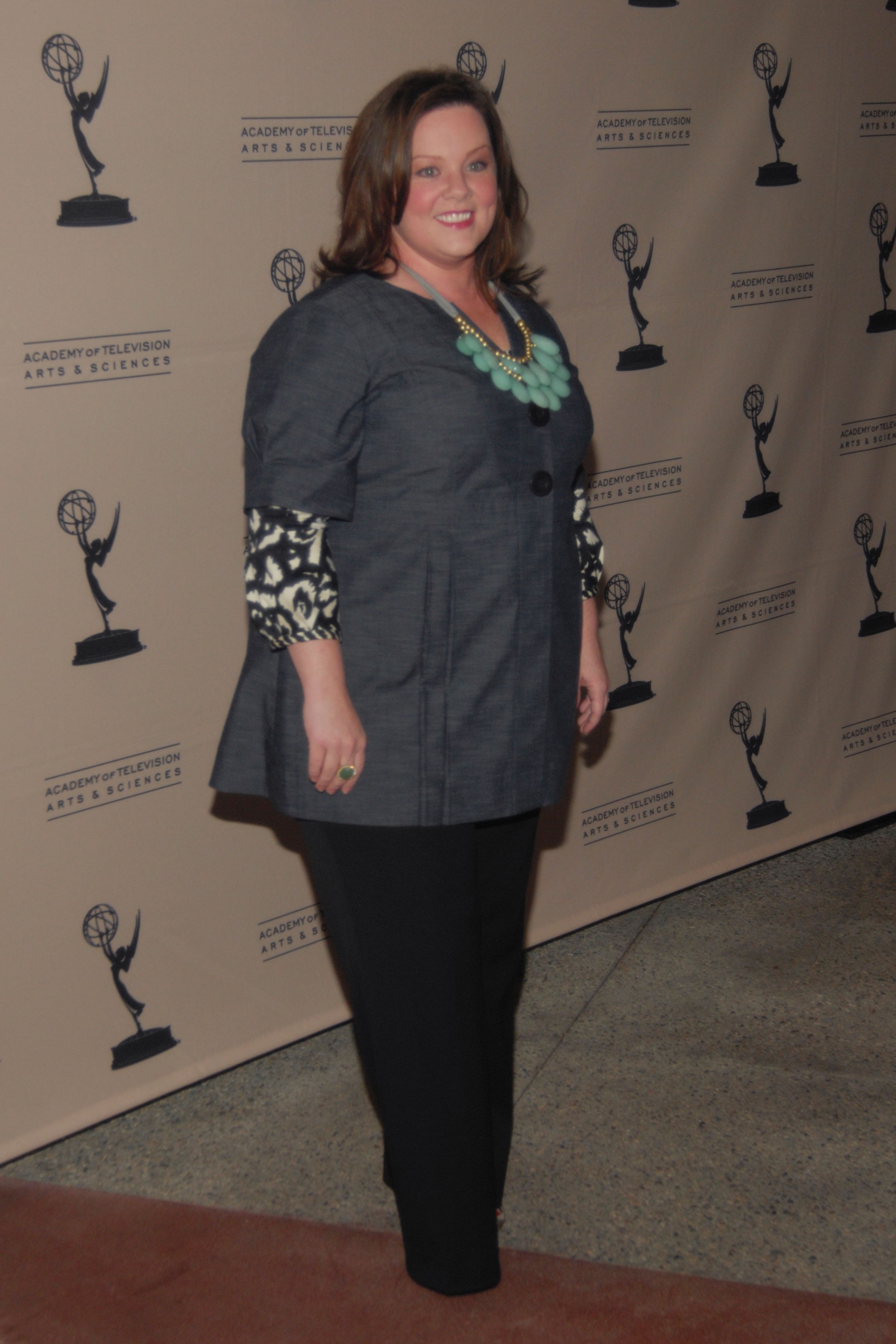 By 2009, McCarthy's style shifted to a more polished look — layered textures, statement jewelry, and a growing red carpet confidence.