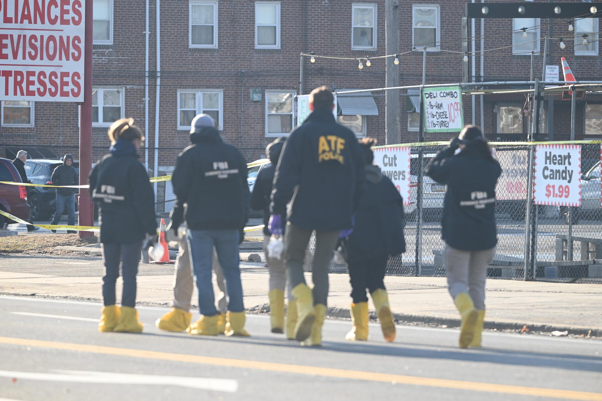 The FBI Evidence Response Team, ATF, NTSB, FAA at the crash scene. | Source: Getty Images