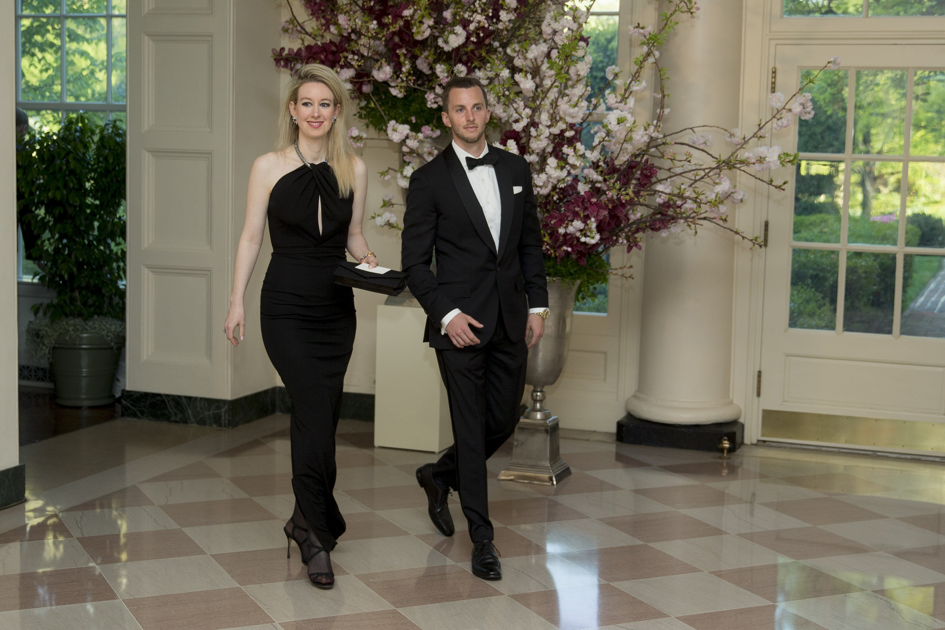 Elizabeth Holmes and Christian Holmes arrive at a state dinner at the White House in Washington, D.C, on Tuesday, April 28, 2015. | Source: Getty Images