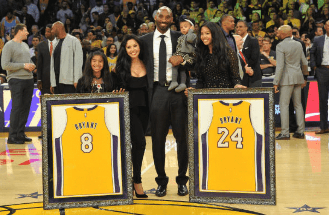 Kobe Bryant, Vanessa Bryant and their daughters Gianna Bryant, Natalia Bryant and Bianka Bella Bryant pose with his retired jerseys during a ceremony at the Staples Center on December 18, 2017, in Los Angeles, California | Source: Allen Berezovsky/Getty Images