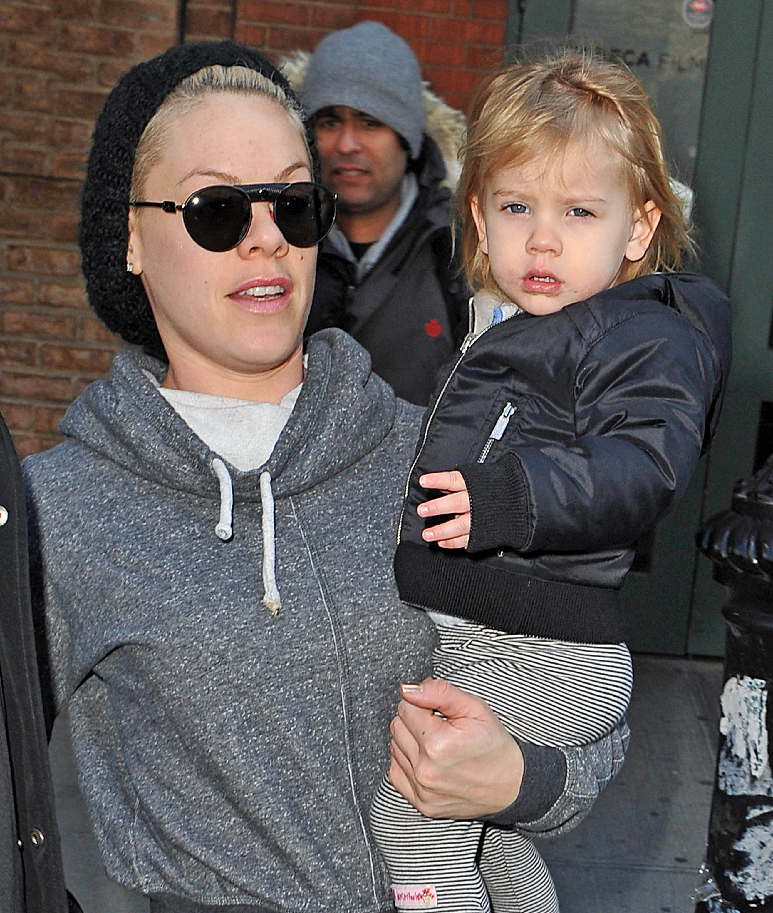 Spotted in New York on March 26, 2013, Willow Sage Hart appeared a little older and more expressive, perched on her mother's hip while taking in the bustle around her. Dressed in a black jacket and striped leggings, with slightly tousled hair framing her face, the toddler fixed the cameras with a steady, almost unimpressed gaze as the pair stepped out together.