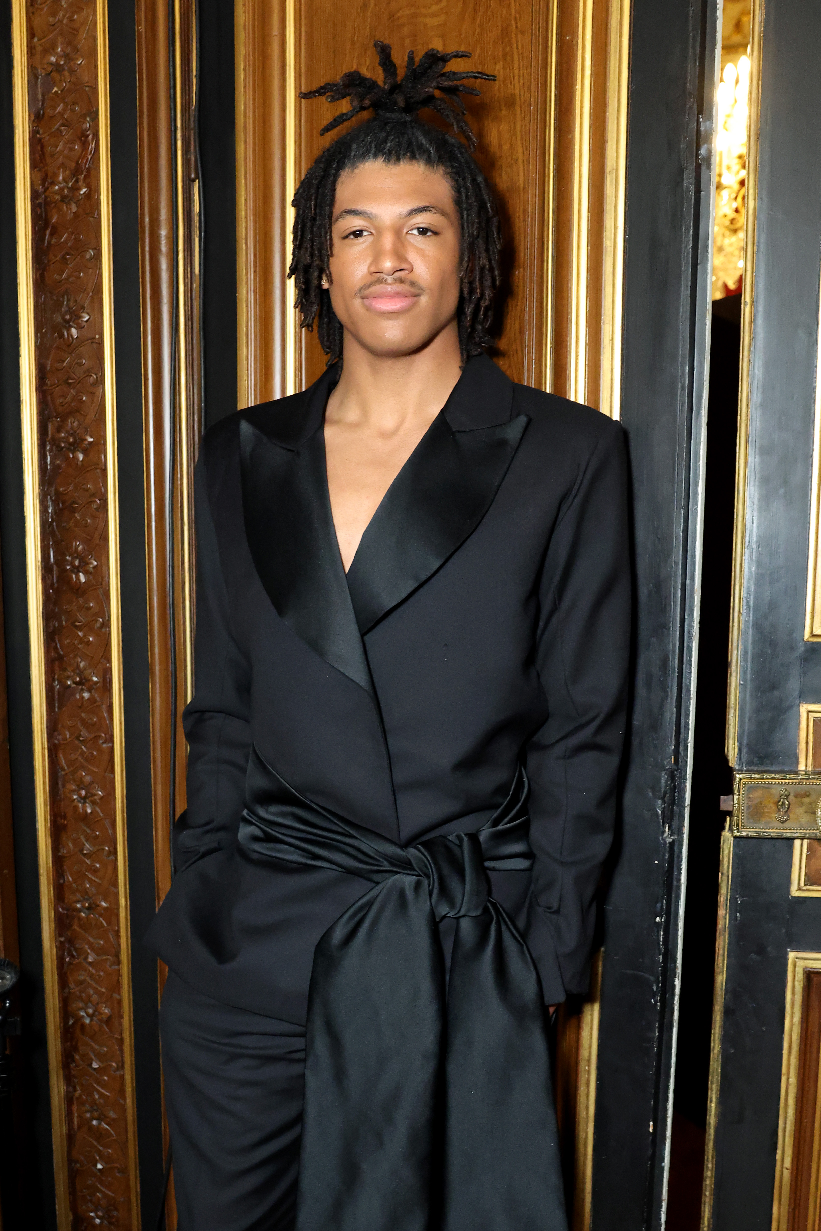 Henry Samuel poses backstage before the Lena Erziak Haute Couture Spring-Summer 2025 show at Paris Fashion Week on January 28, 2025 | Source: Getty Images