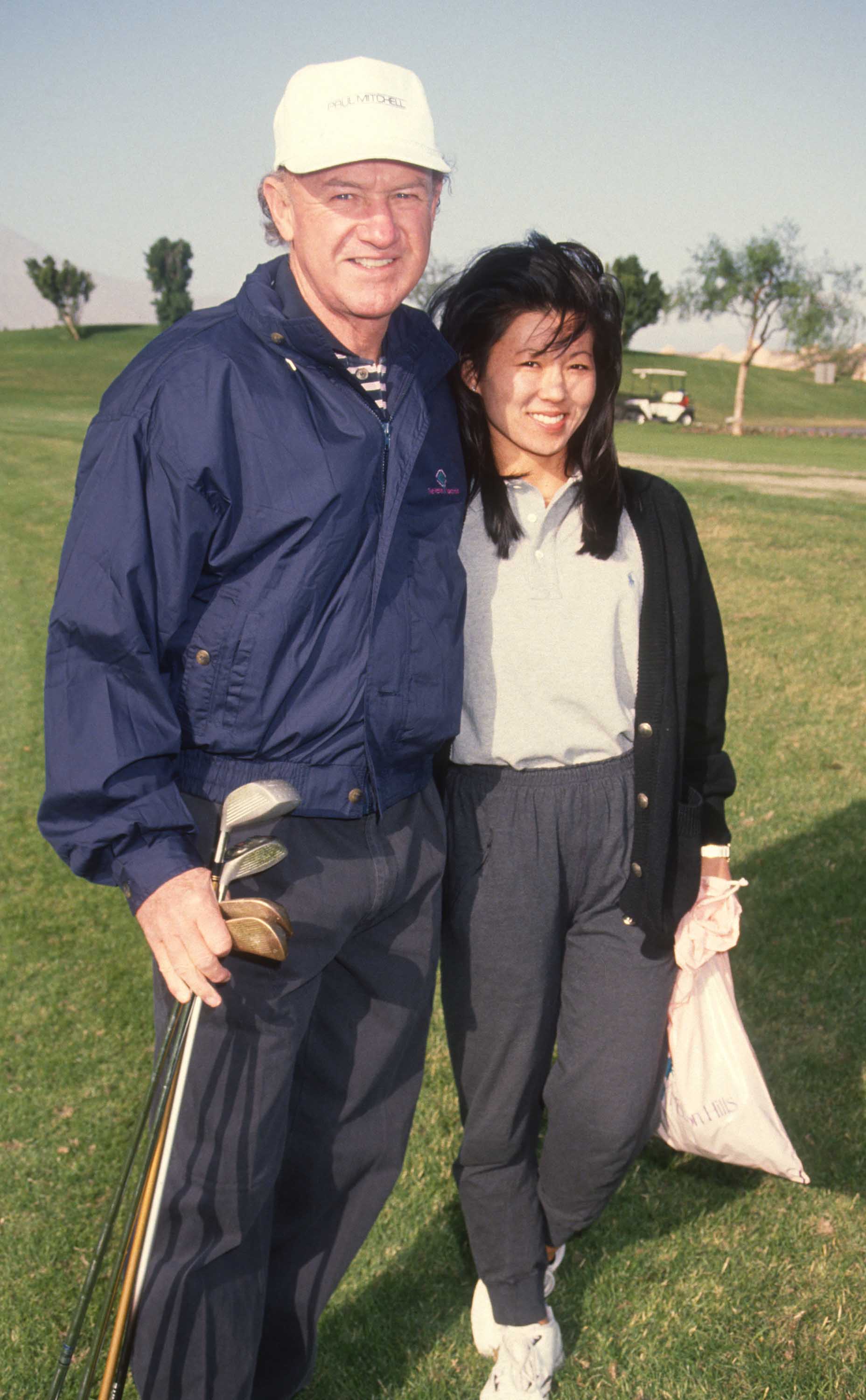 Gene Hackman and Betsy Arakawa are seen at the Mission Hills Celebrity Sports Invitational, Rancho Mirage, California, on November 30, 1991 | Source: Getty Images