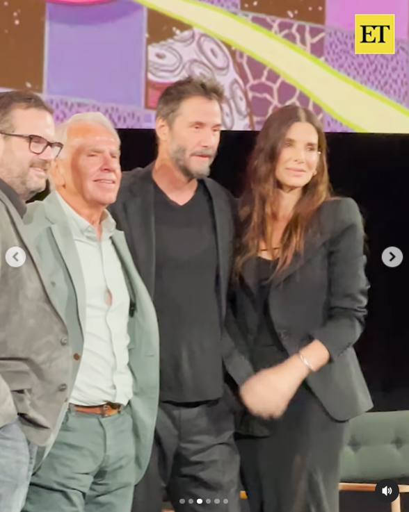 Keanu Reeves, Jan de Bont, and Sandra Bullock onstage in Los Angeles, posted on October 9, 2024 | Source: Instagram.com/entertainmenttonight