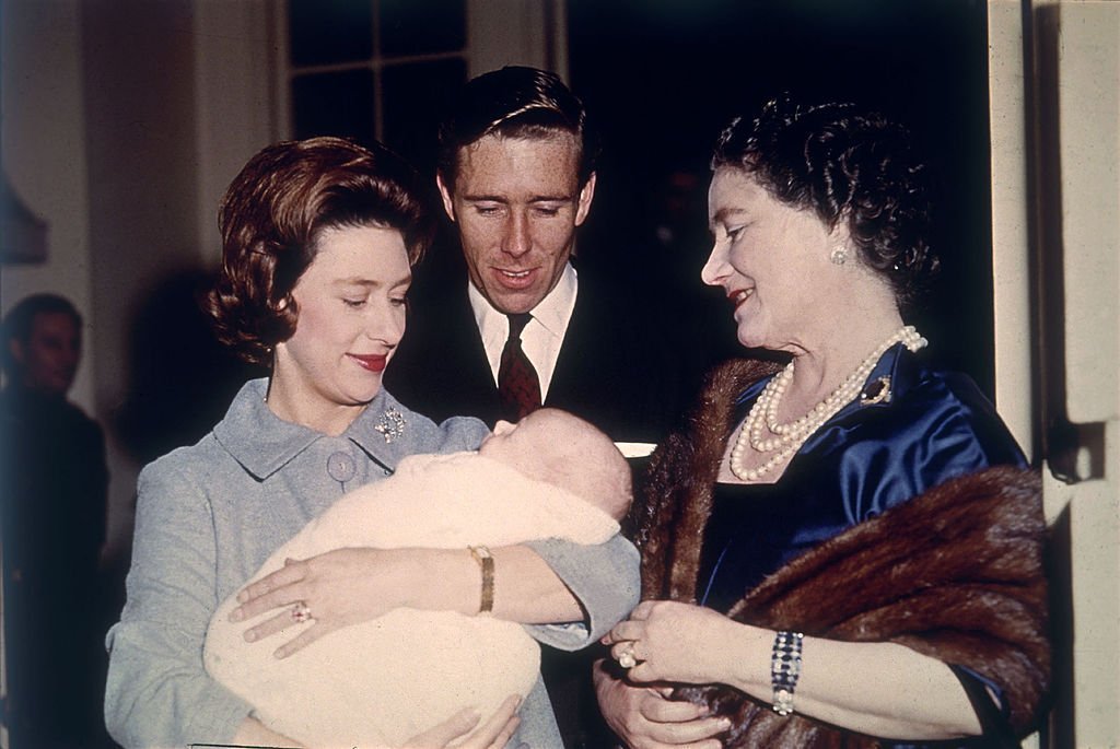 The Queen Mother is introduced to baby David Linley in 1961 by his proud parents Princess Margaret (L) and Lord Snowdon | Photo: Getty Images