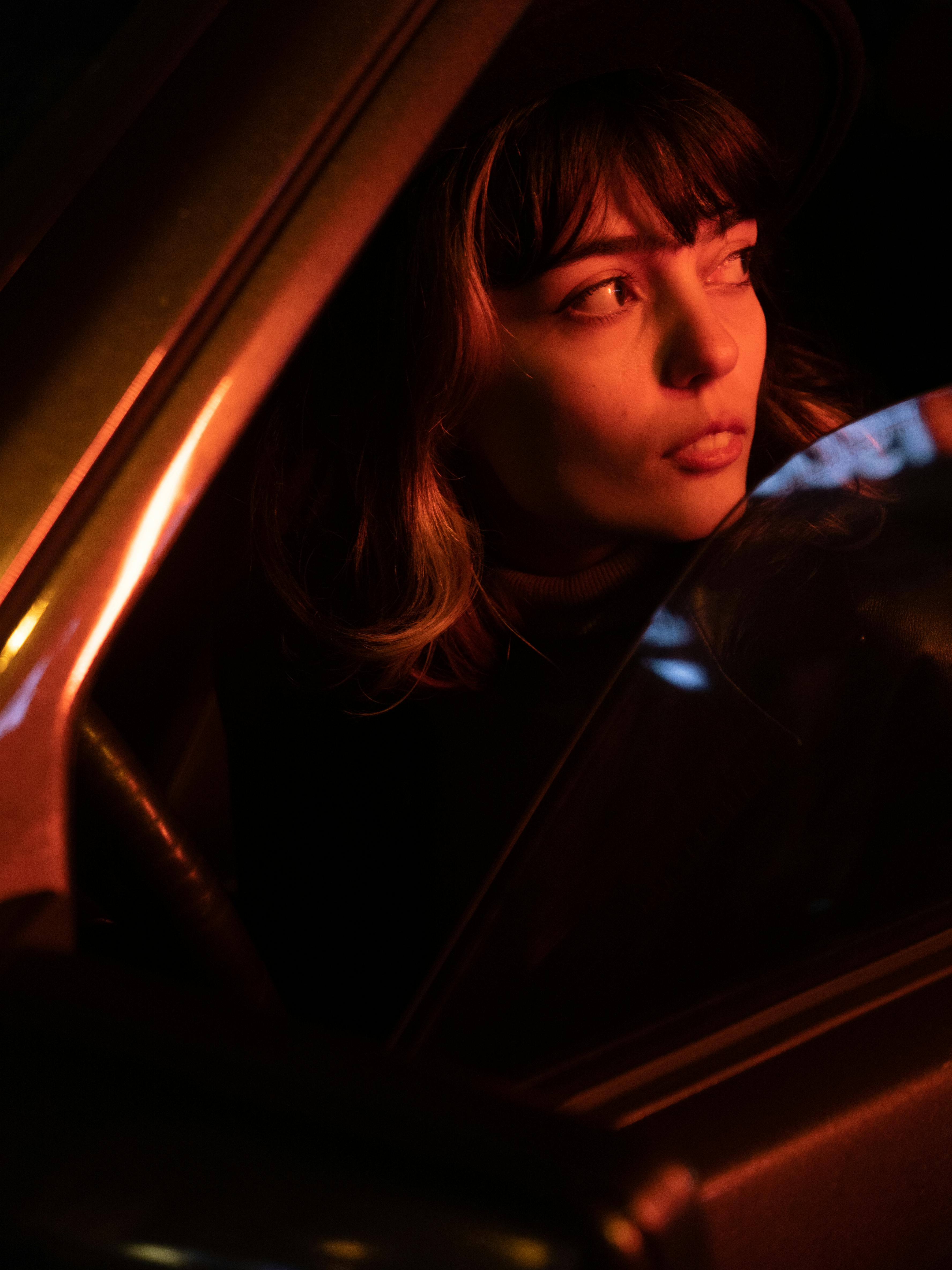 A woman driving at night | Source: Pexels