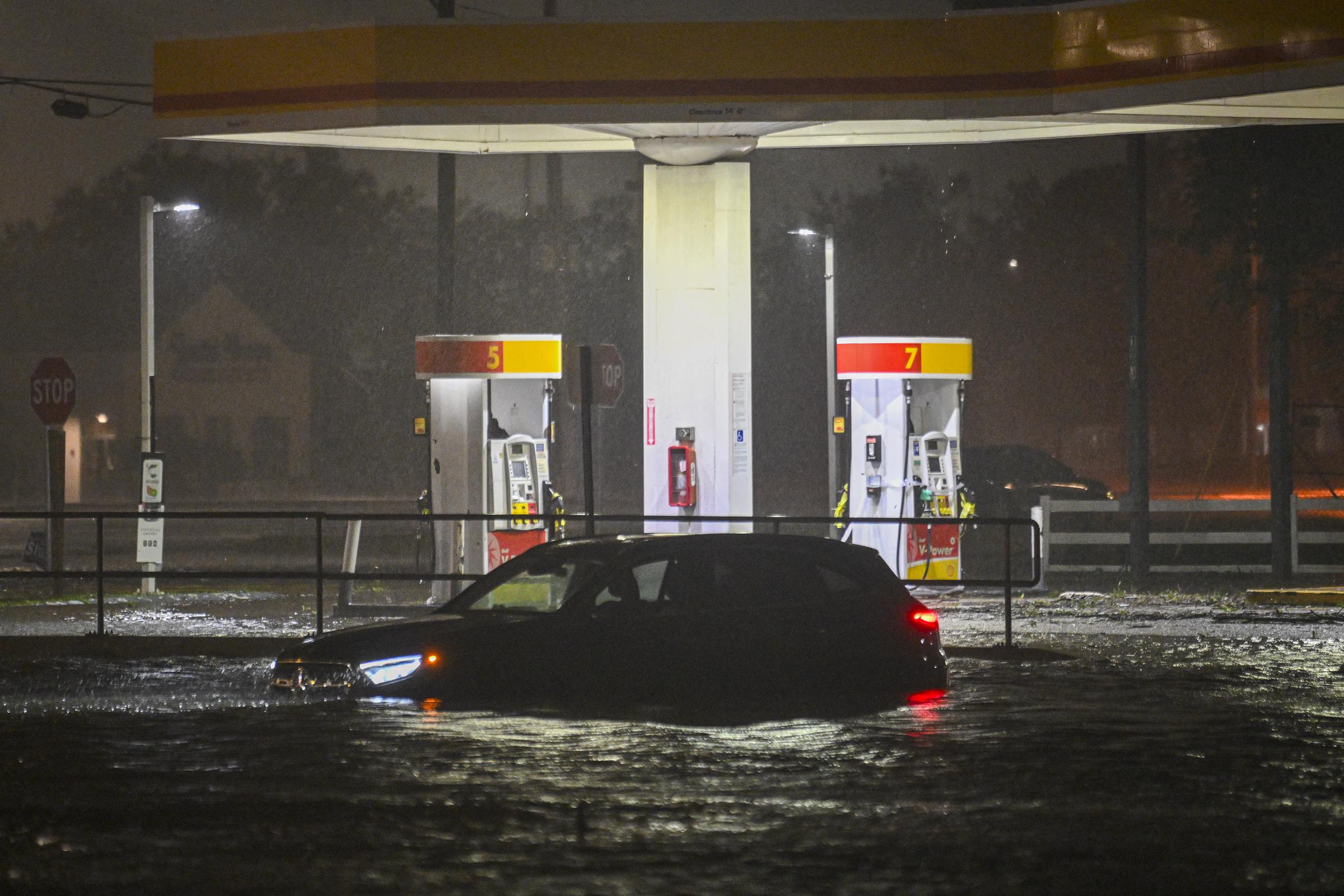 A vehicle is stranded on a water-flooded street after Hurricane Milton made landfall in Brandon, Florida on October 9, 2024 | Source: Getty Images