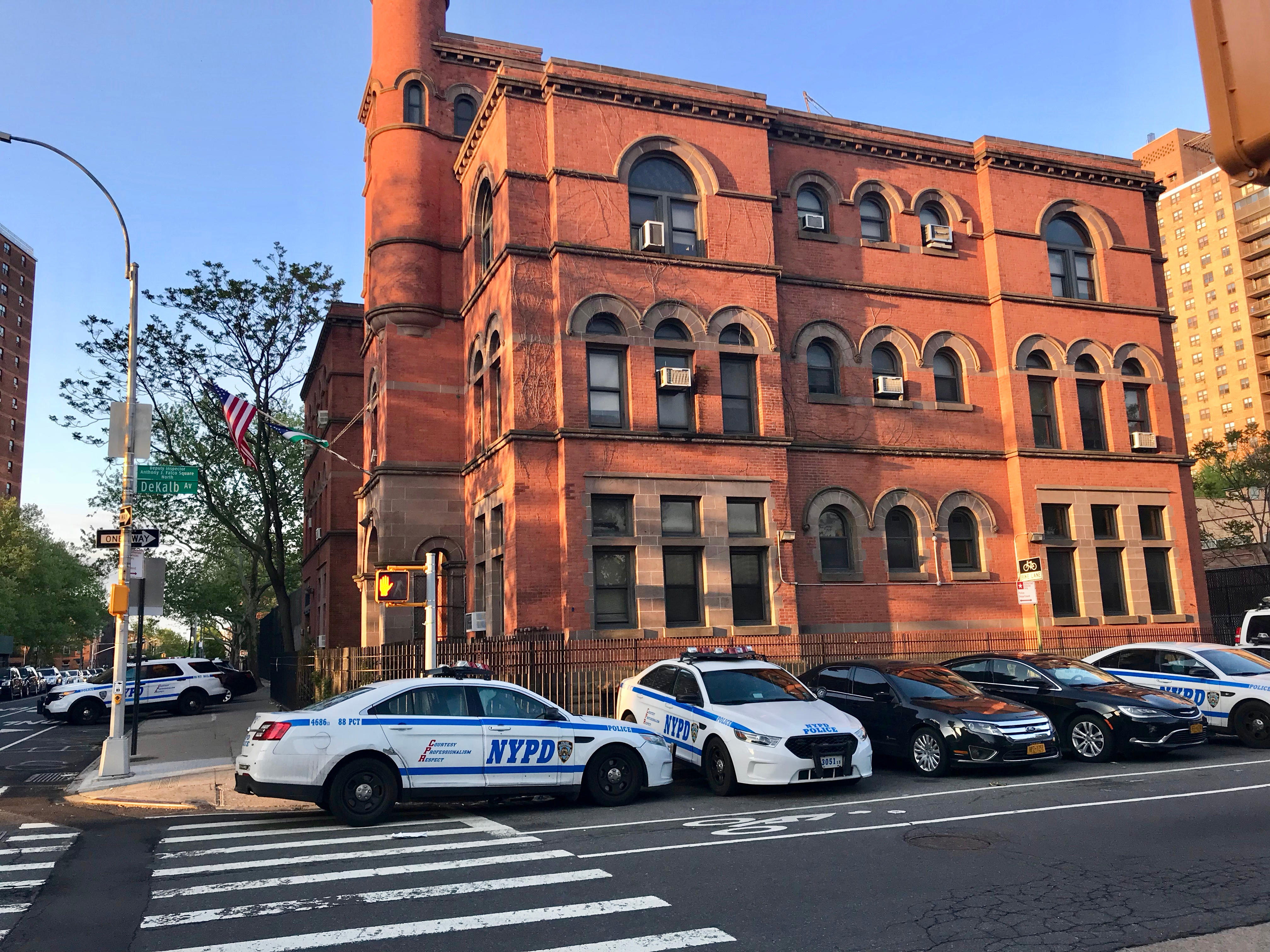 New York City Police Department 88th Precint, Brooklyn - Police station at the corner of Classon Avenue and Dekalb Avenue with several police interceptors parked in front of the building - NYC, USA | Source: Shutterstock