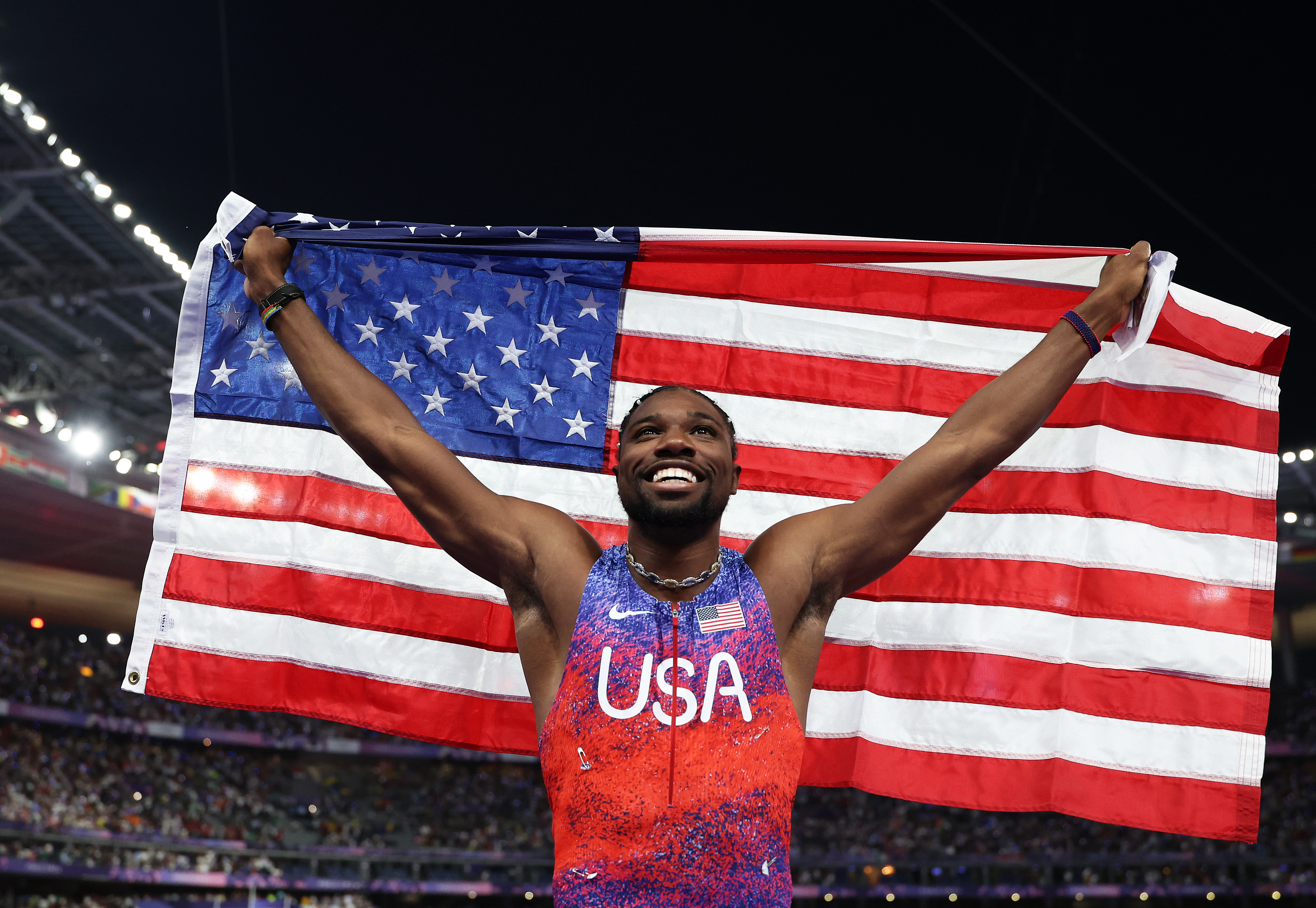 Noah Lyles celebrates winning the gold medal after competing the Men's 100m Final at the Olympic Games Paris 2024 in Paris, France, on August 4, 2024. | Source: Getty Images