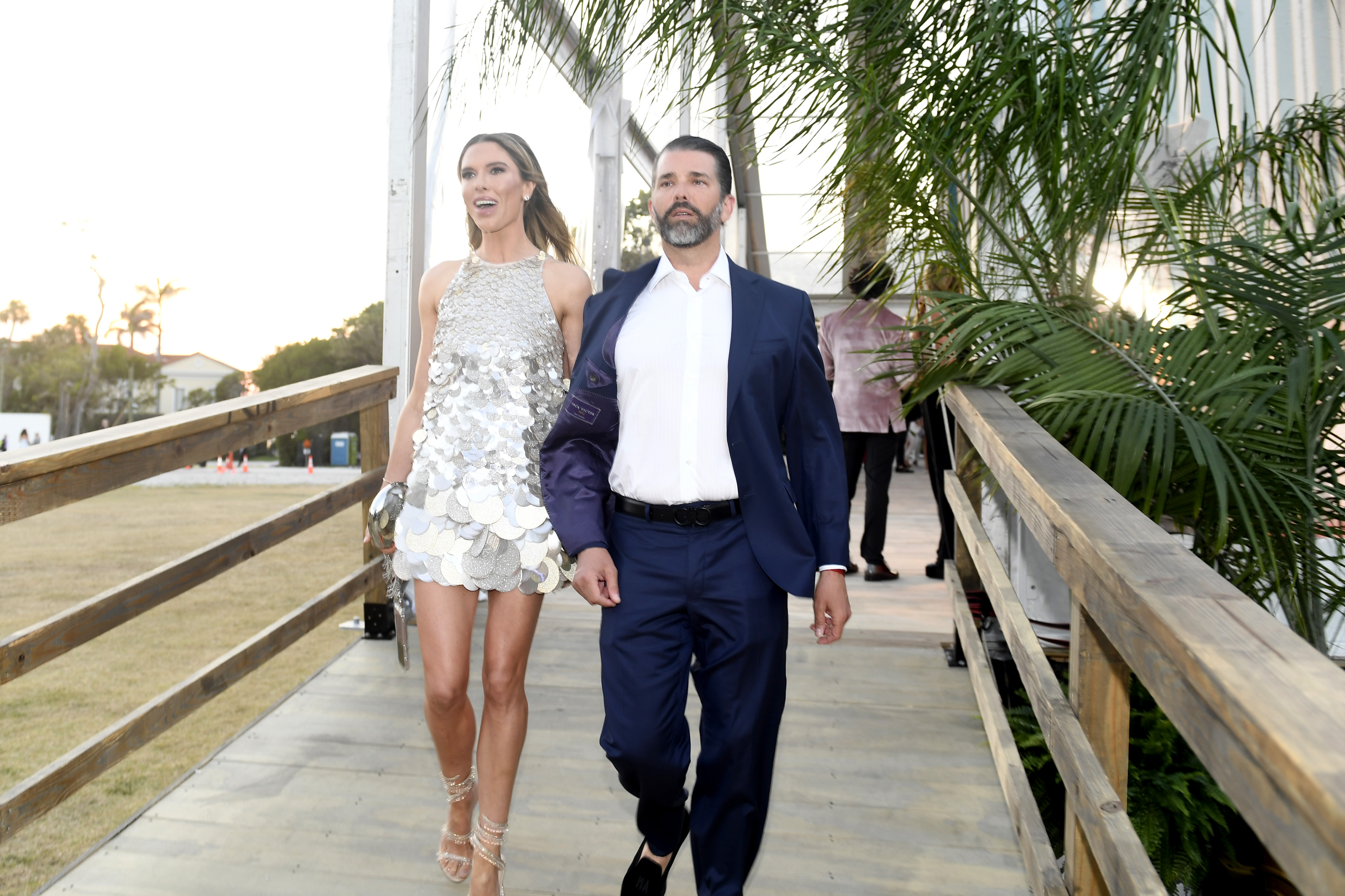 Donald Trump Jr. and Bettina Anderson walk into the amfAR Palm Beach Gala in Palm Beach, Florida, on March 15, 2025 | Source: Getty Images