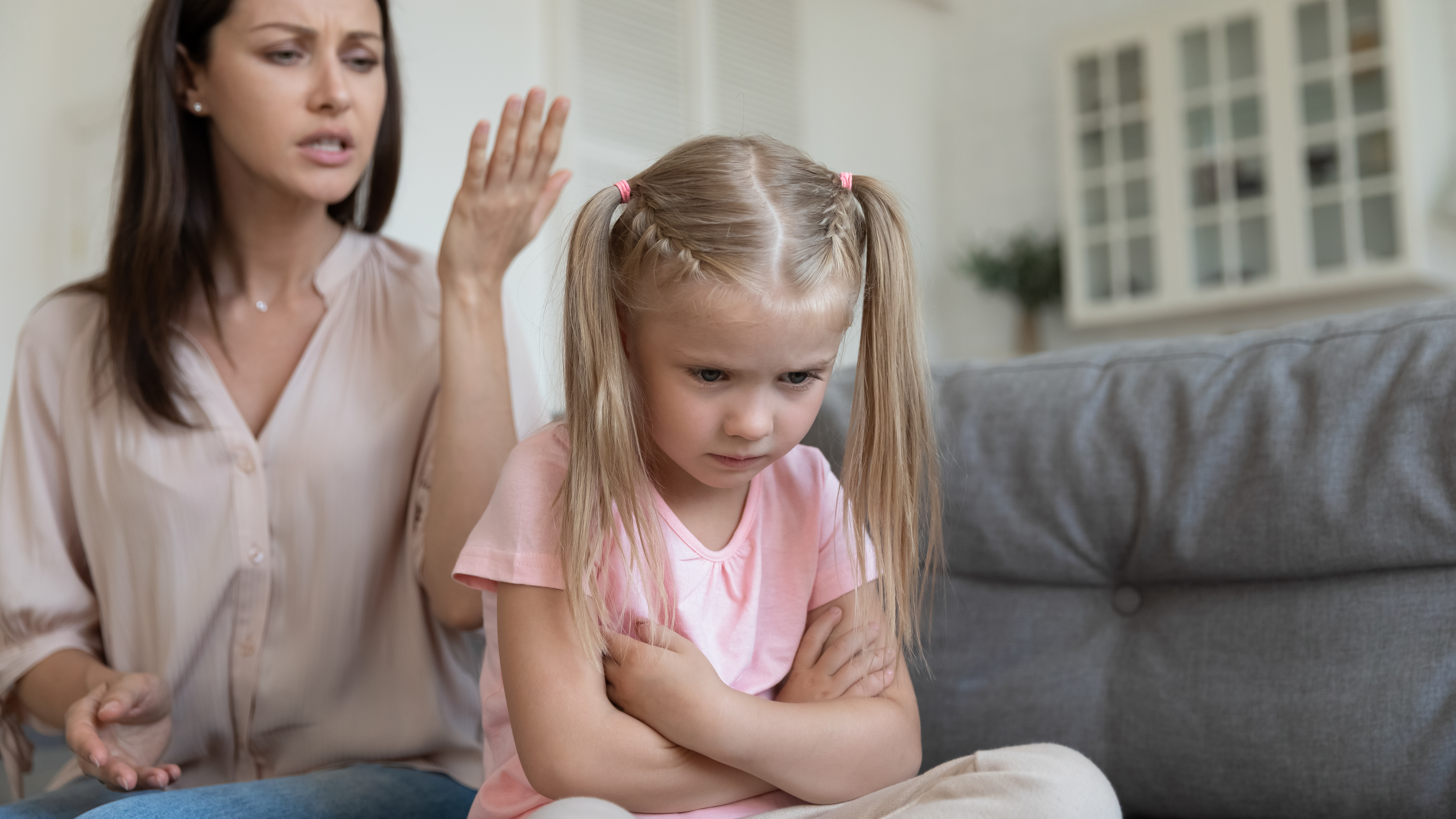 A mother tries to school her angry little daughter | Source: Shutterstock