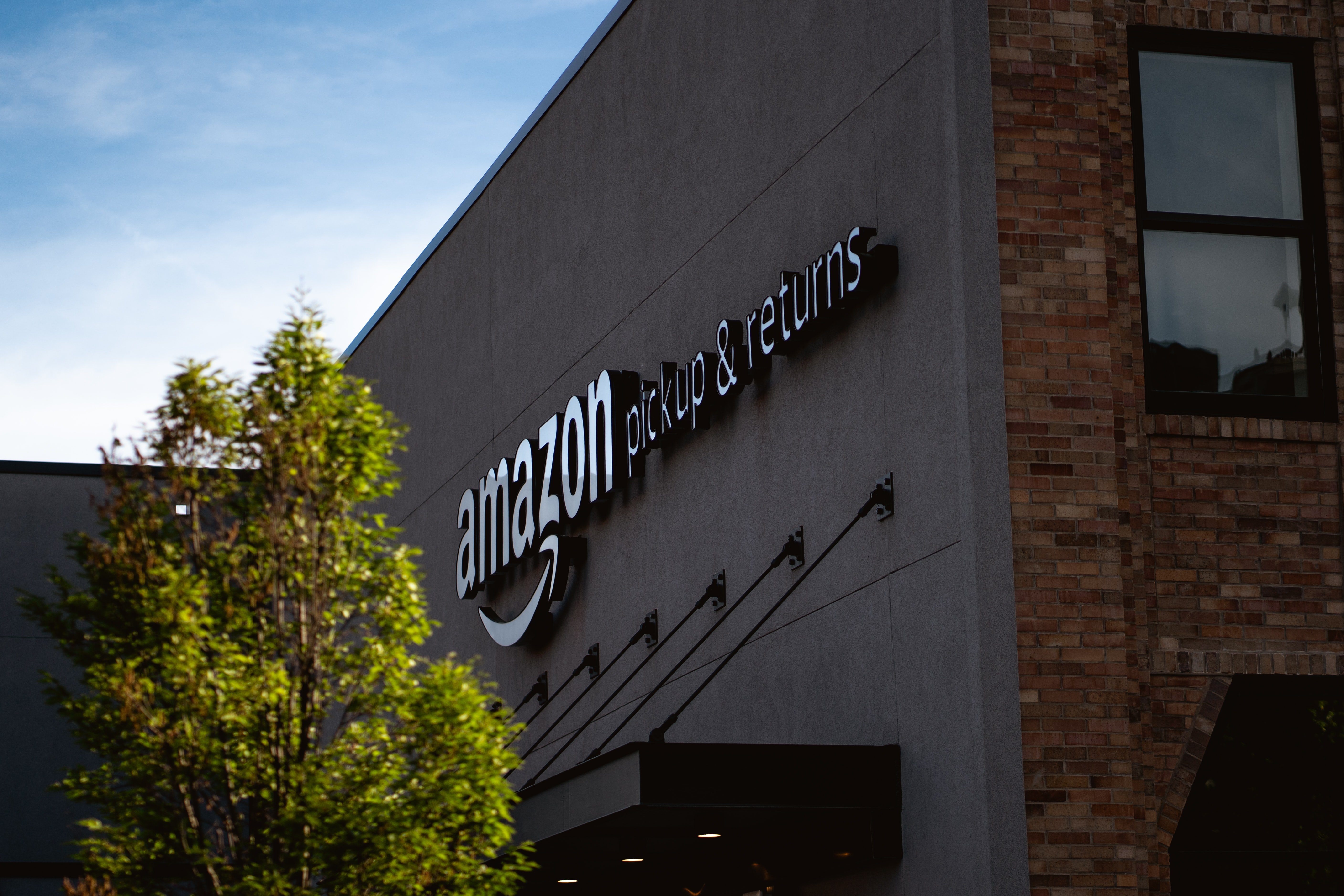 One of the Amazon buildings that houses their pickups and returns | Photo: Unsplash/Bryan Angelo