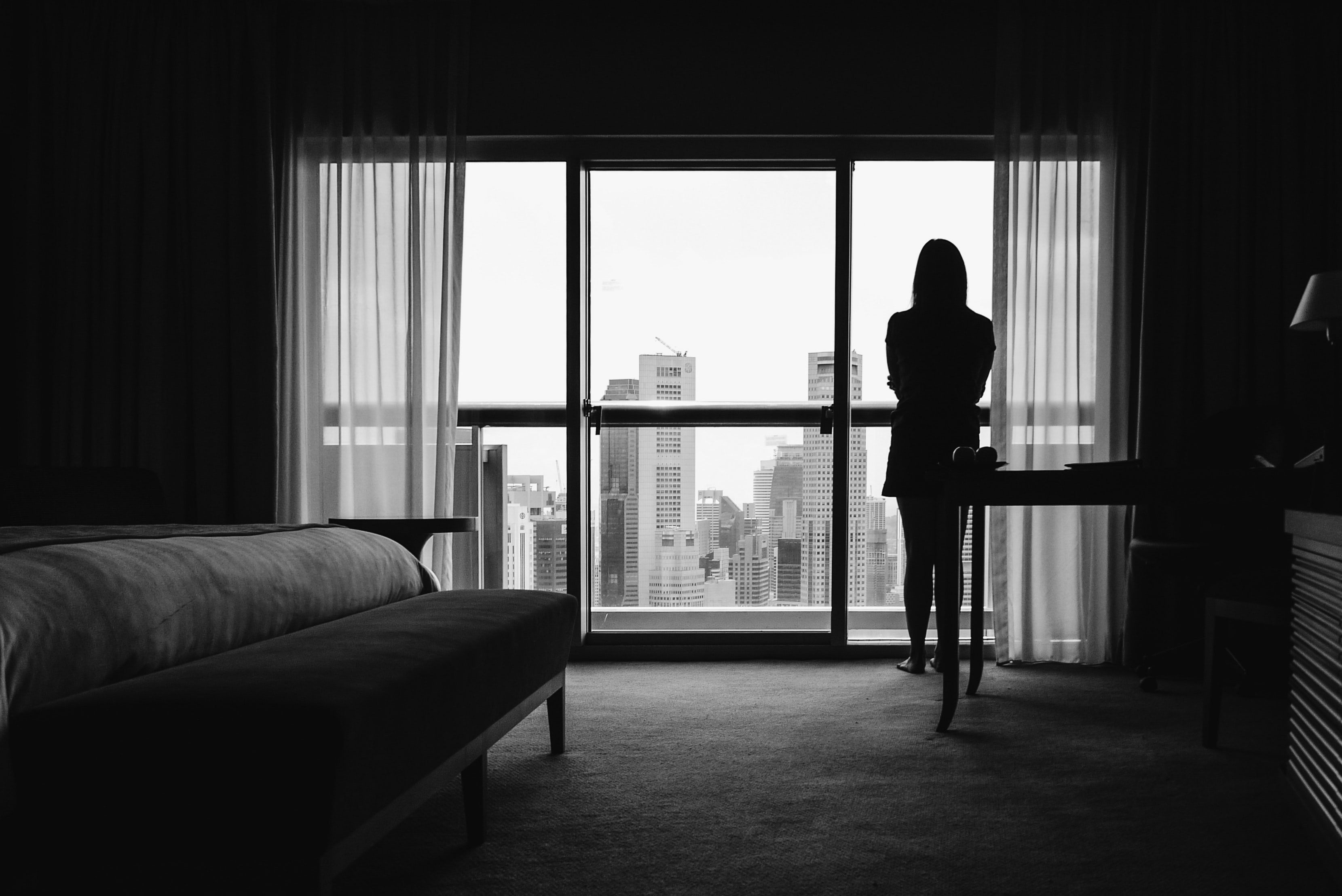 Woman standing next to a window | Source: Unsplash