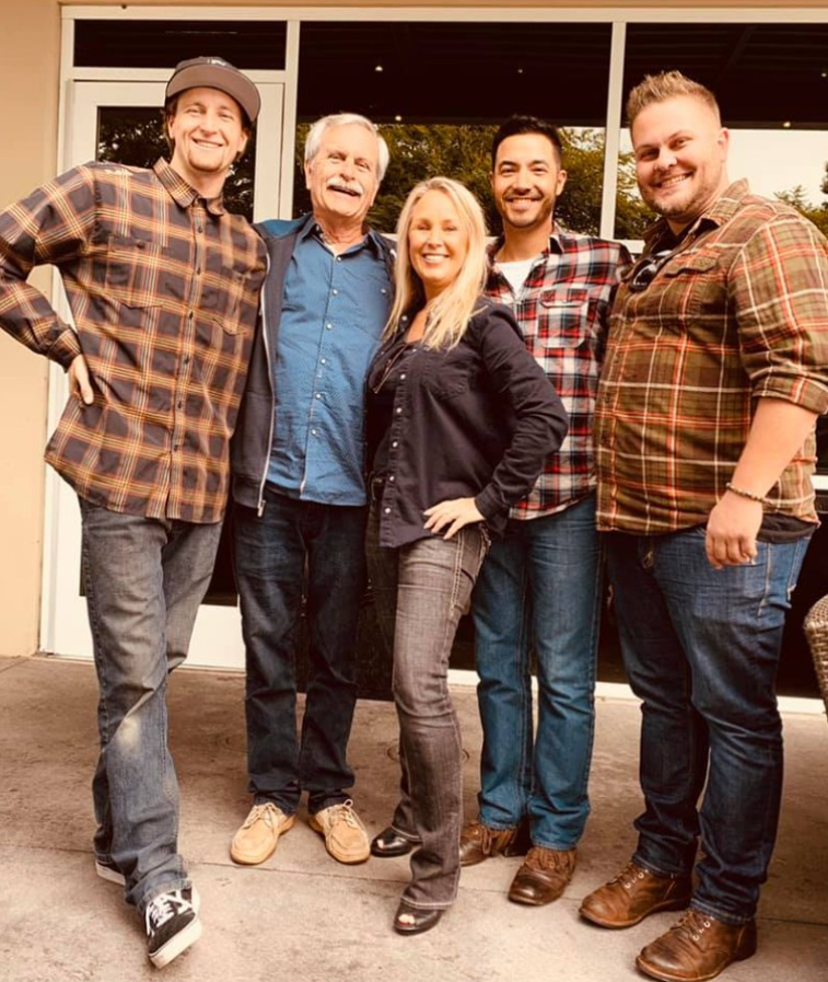 Michael Ryan Burke takes photo with his friends and family,  from a post dated January 20, 2026. | Source: Facebook/MichelleMooreWinder