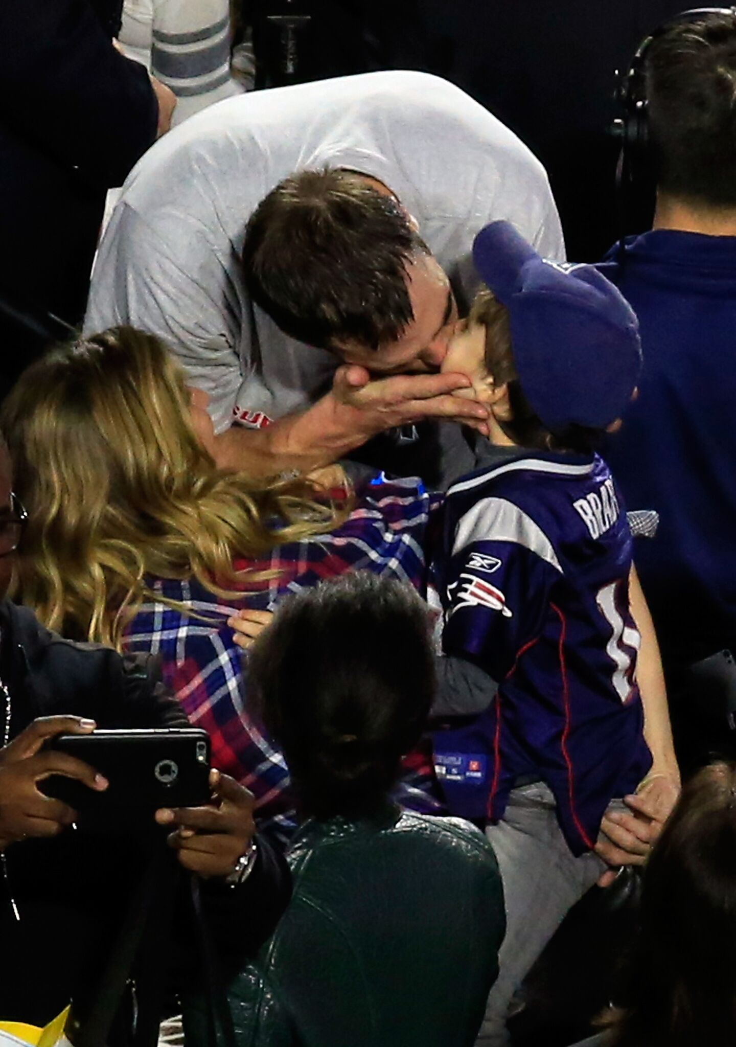 Tom Brady #12 of the New England Patriots celebrates defeating the Seattle Seahawks with his wife Gisele Bundchen and son Benjamin during Super Bowl XLIX at University of Phoenix Stadium | Getty Images