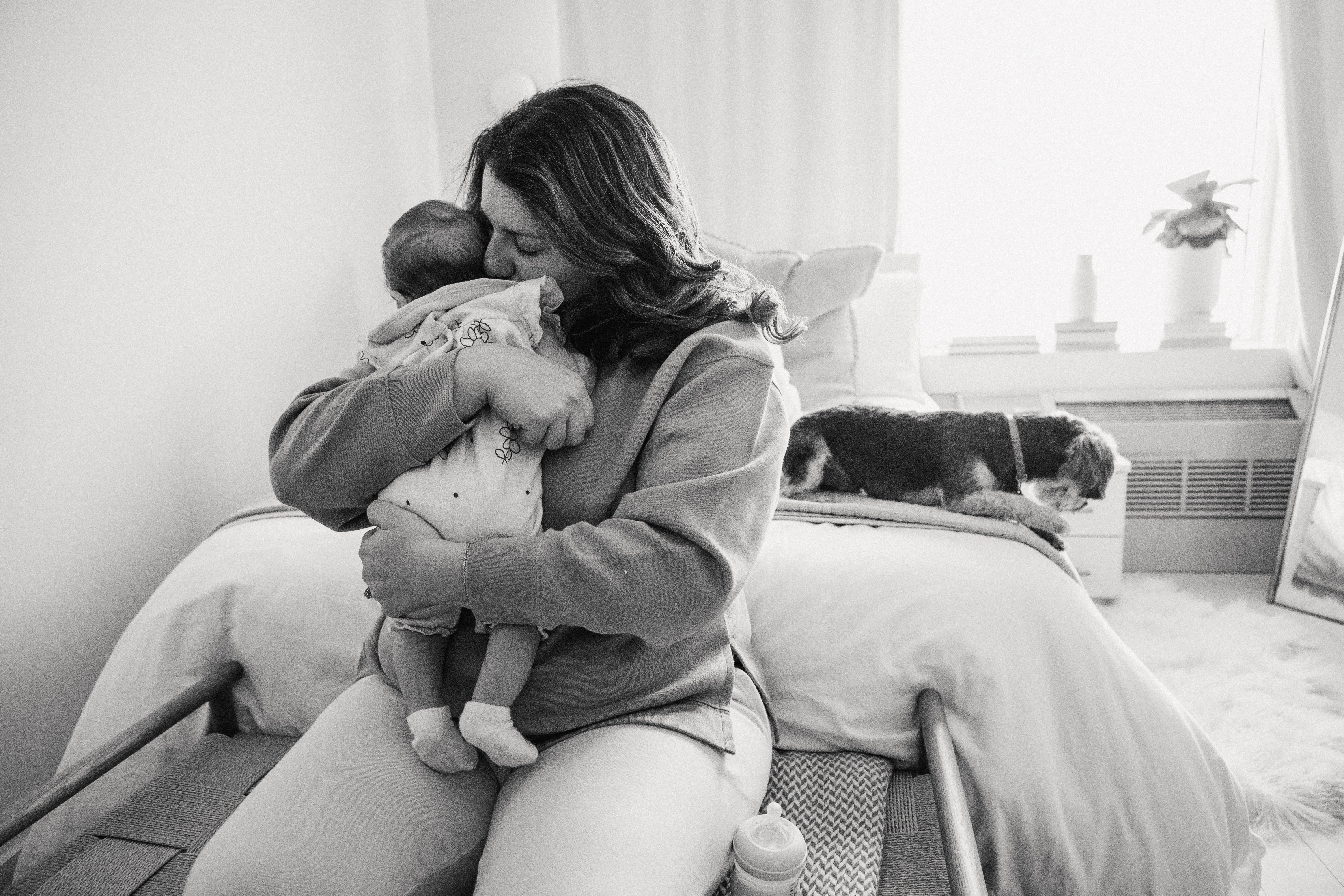 A mother hugging her baby | Source: Pexels