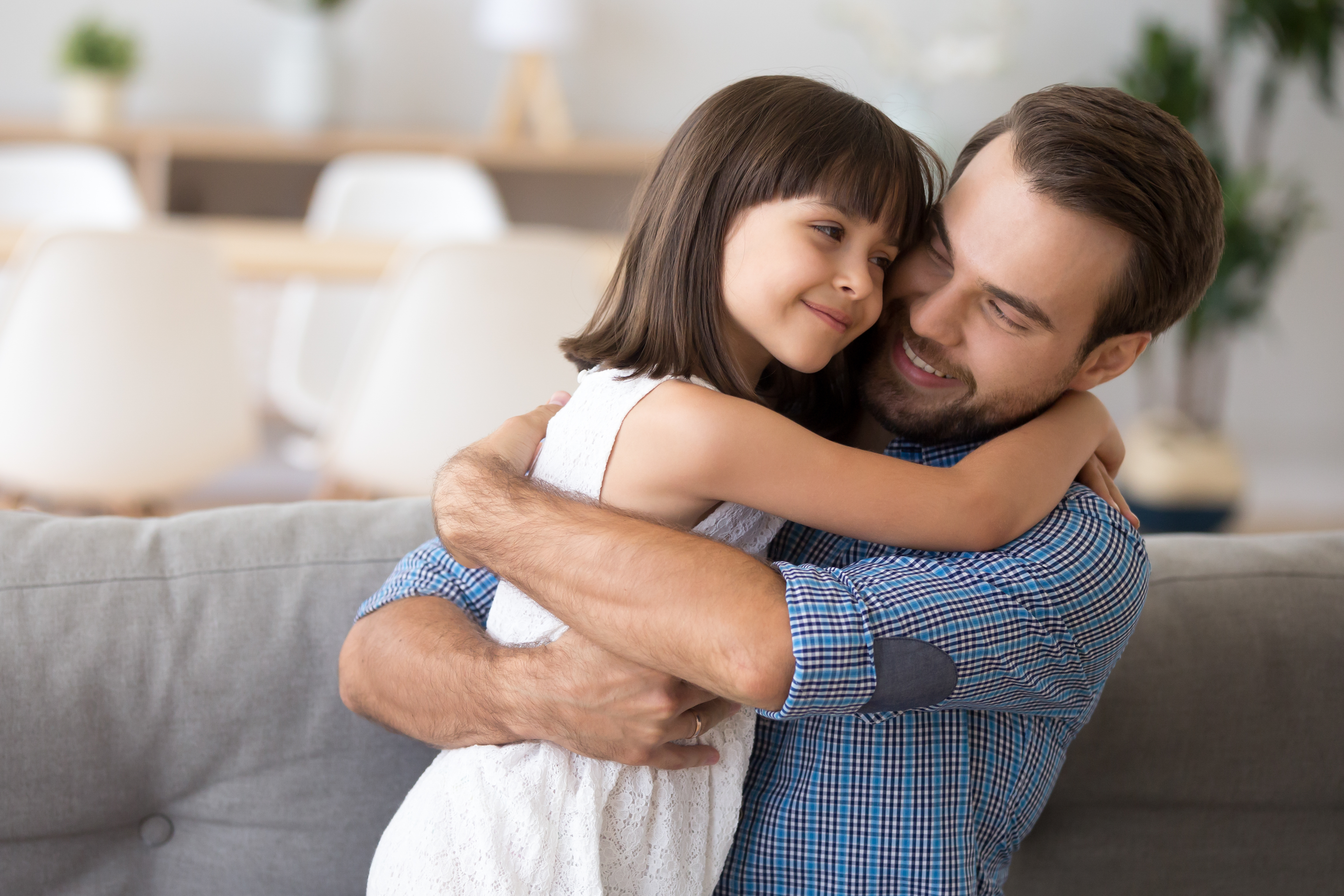 A father and daughter hugging | Source: Shutterstock