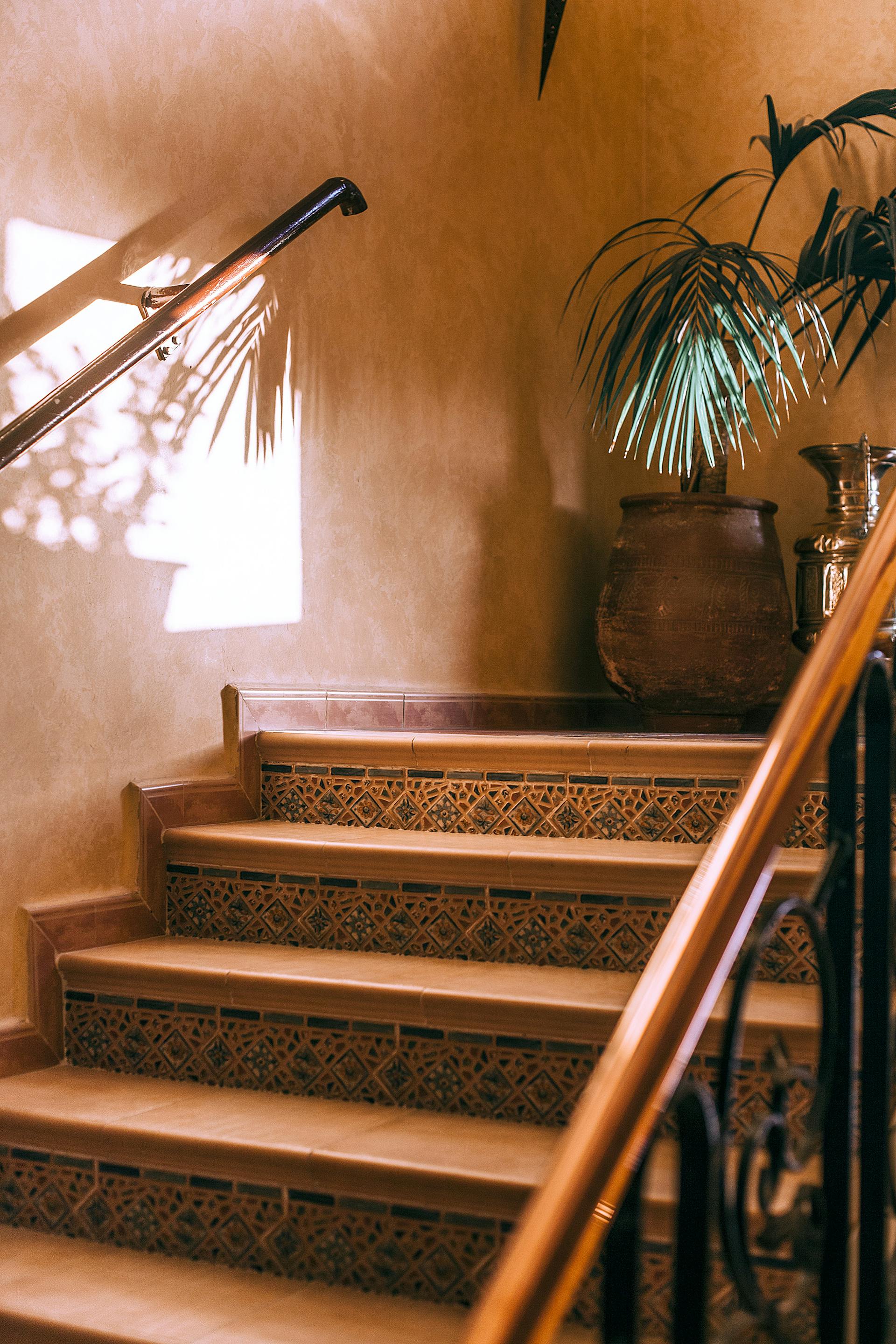 A brown colored stone staircase in a house | Source: Pexels