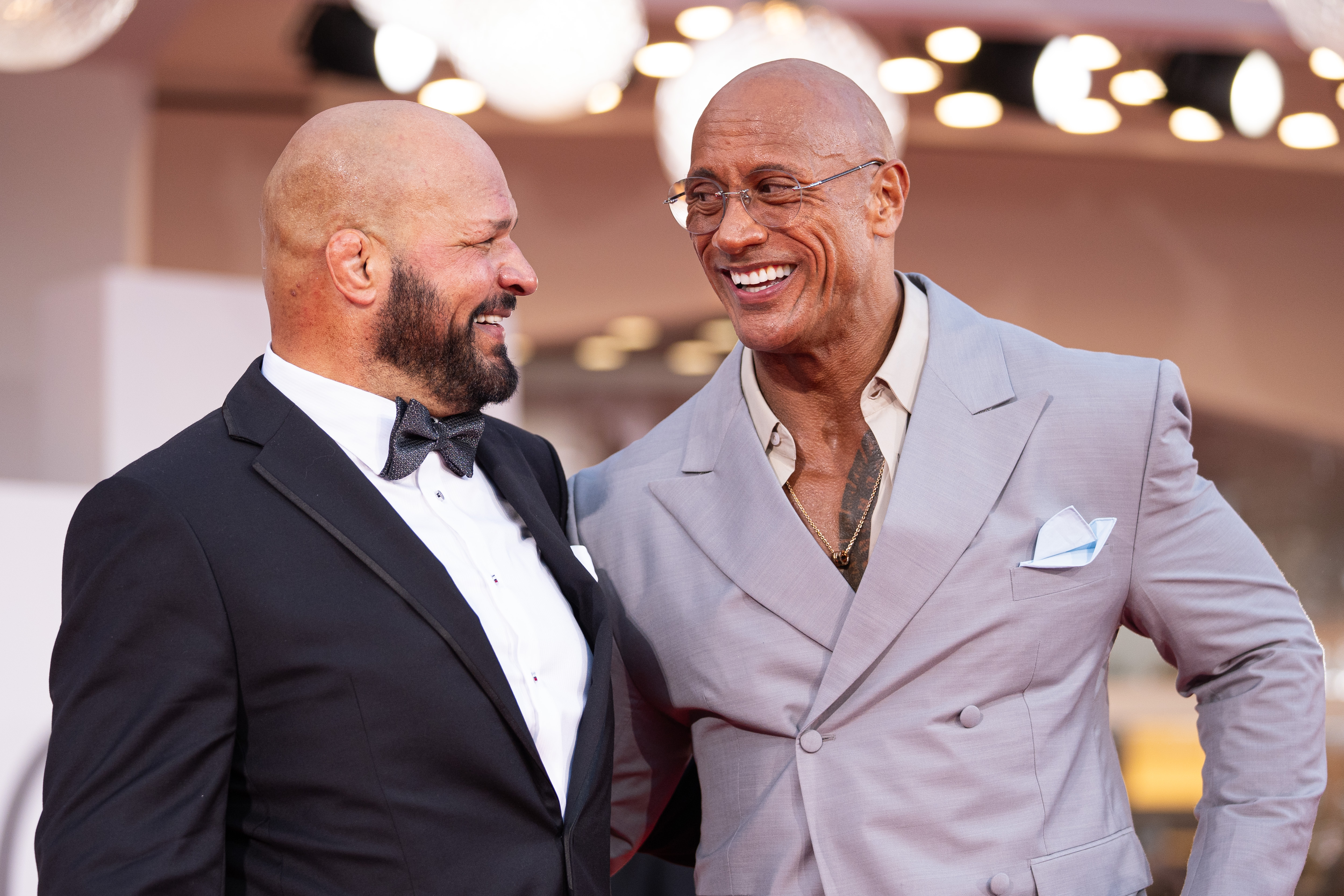 Mark Kerr and Dwayne Johnson attend "The Smashing Machine" red carpet during the 82nd Venice International Film Festival on September 1, 2025, in Venice, Italy. | Source: Getty Images