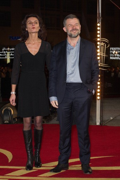 Eric Naulleau et son épouse arrivent à la cérémonie de remise du prix du 12ème Festival international du film de Marrakech à Marrakech, Maroc. | Photo: Getty Images