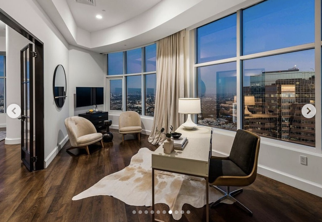 A seating area by the window of Rihanna's Century City penthouse, published in March 2024 | Source: instagram/robbreportrealestate