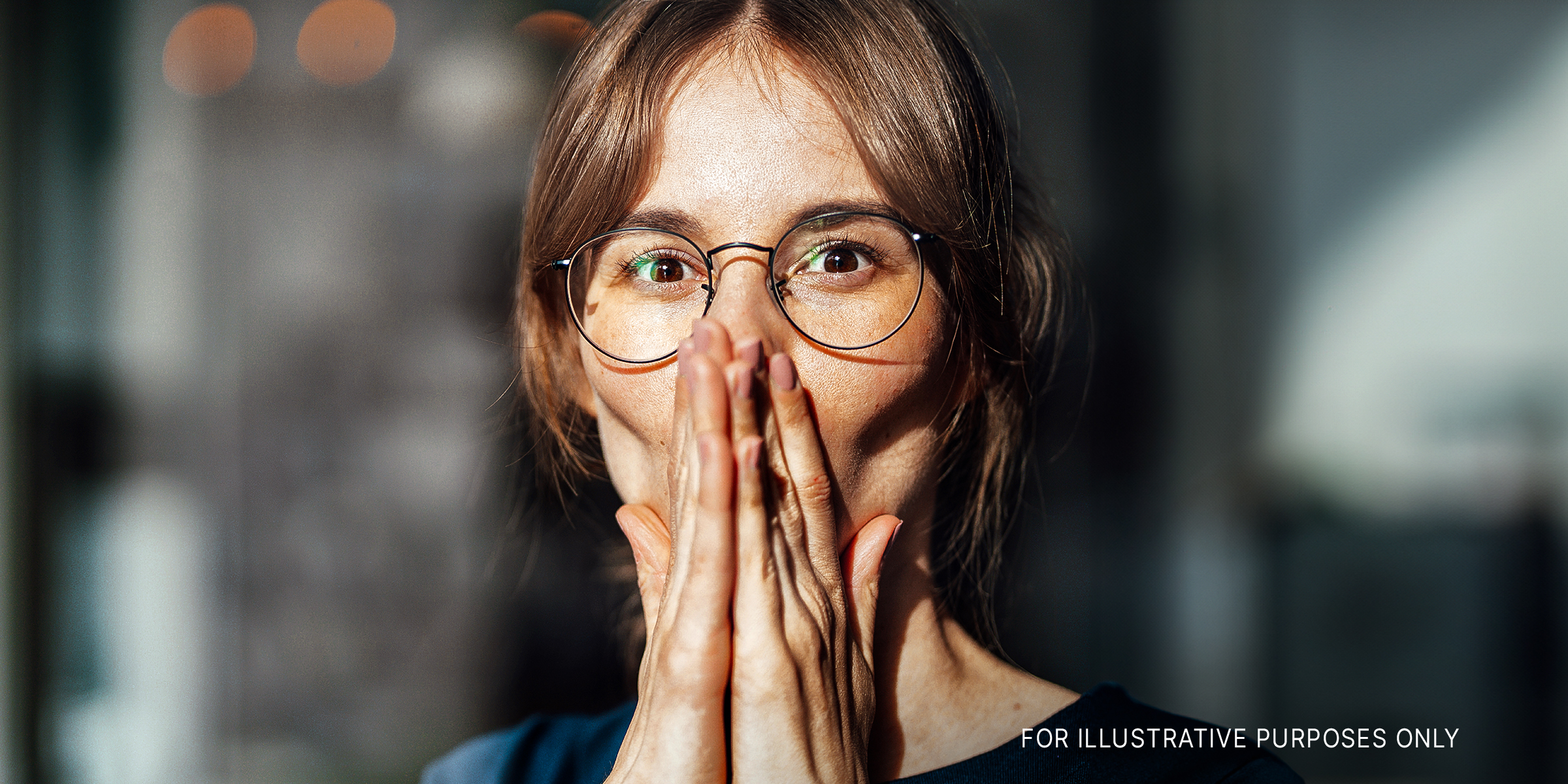 Woman with hands together in surprise | Source: Getty images