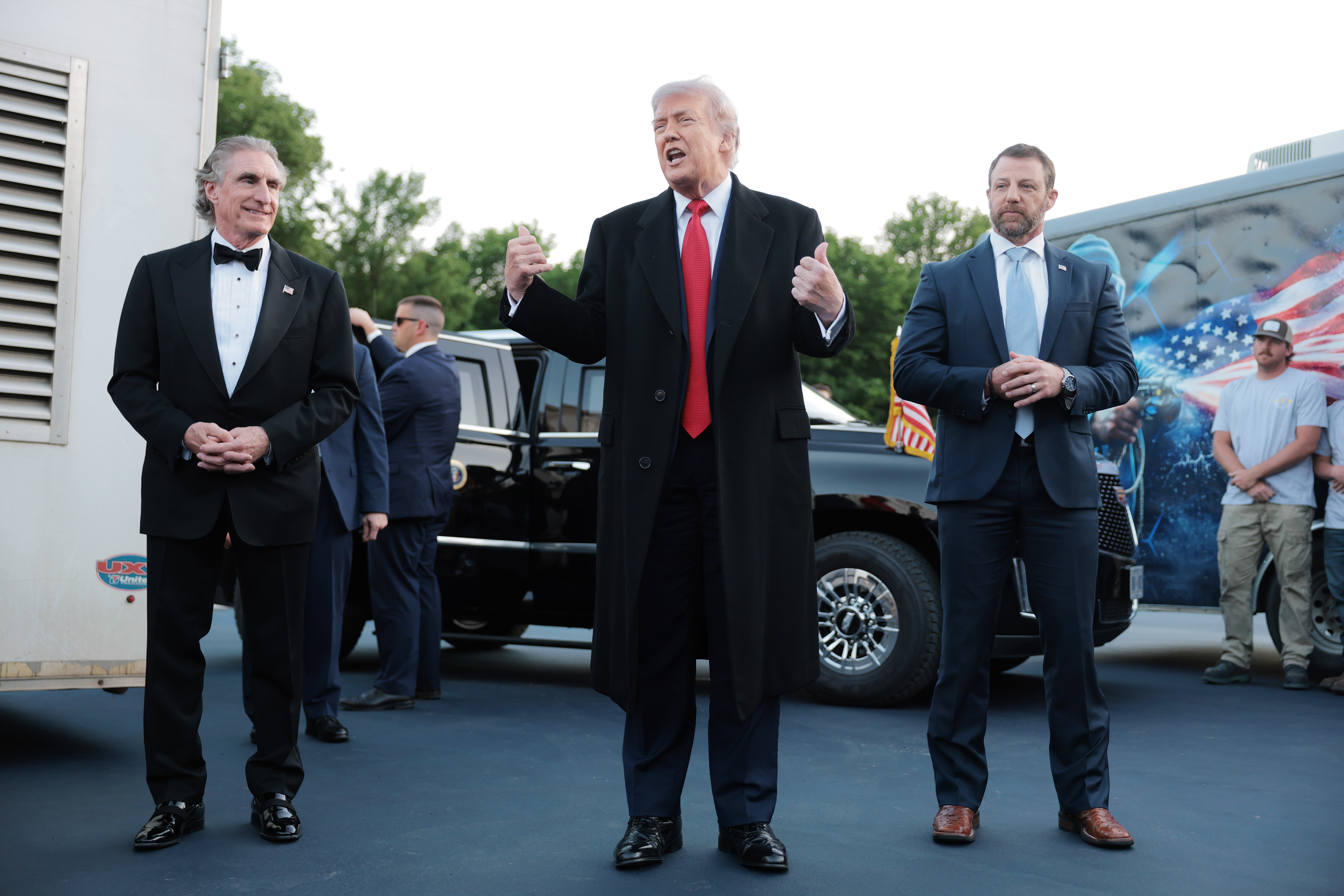 Donald Trump speaks as he inspects the painting of the Lincoln Memorial Reflecting Pool basin, with U.S. Secretary of the Interior Doug Burgum (L) and U.S. Secretary of Homeland Security Markwayne Mullin (R) looking on, on May 7, 2026 in Washington, DC | Source: Getty Images