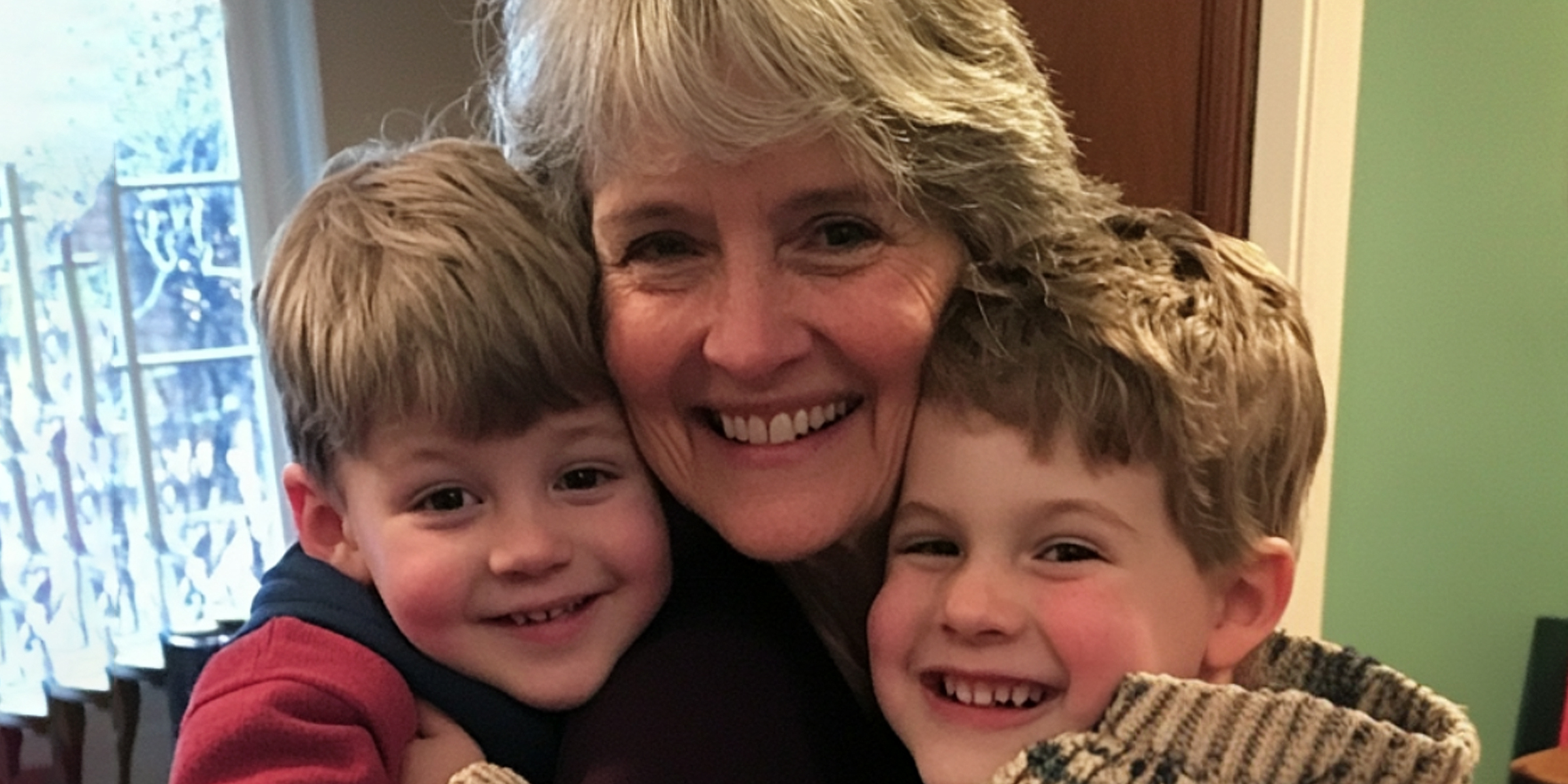 A senior woman with her twin grandsons | Source: Amomama