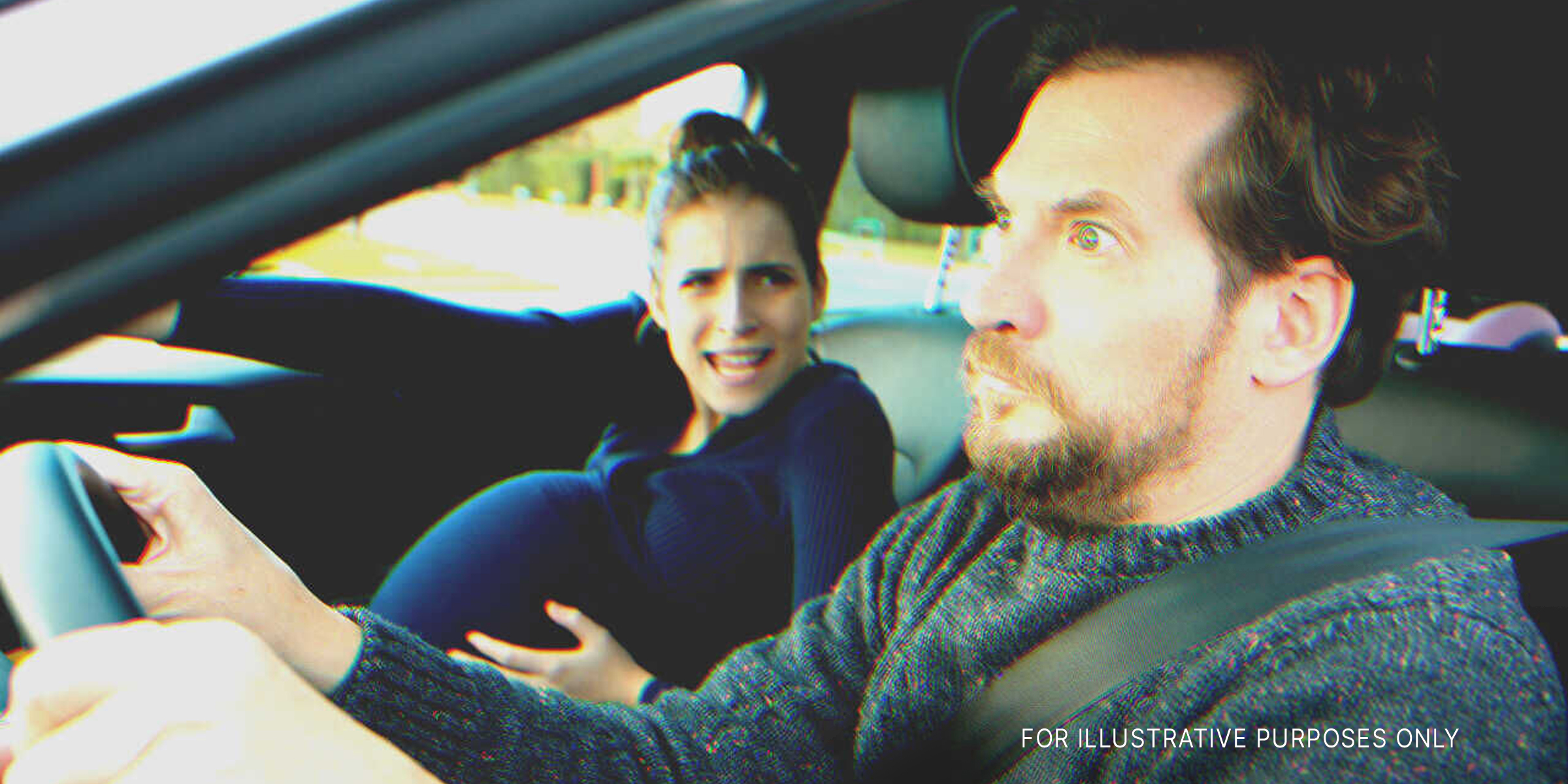 A man looking terrified while driving with a pregnant woman in labor | Source: Shutterstock