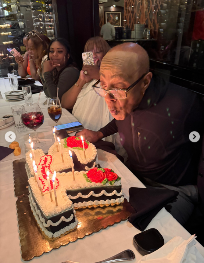 Peabo Bryson blows out the candles on a custom birthday cake during his 75th birthday celebration in April 2026. The singer shared photos from the intimate gathering on social media. | Source: Instagram/peabobryson2