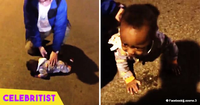 Mom was charged after viral video of her infant son crawling into busy street surfaced