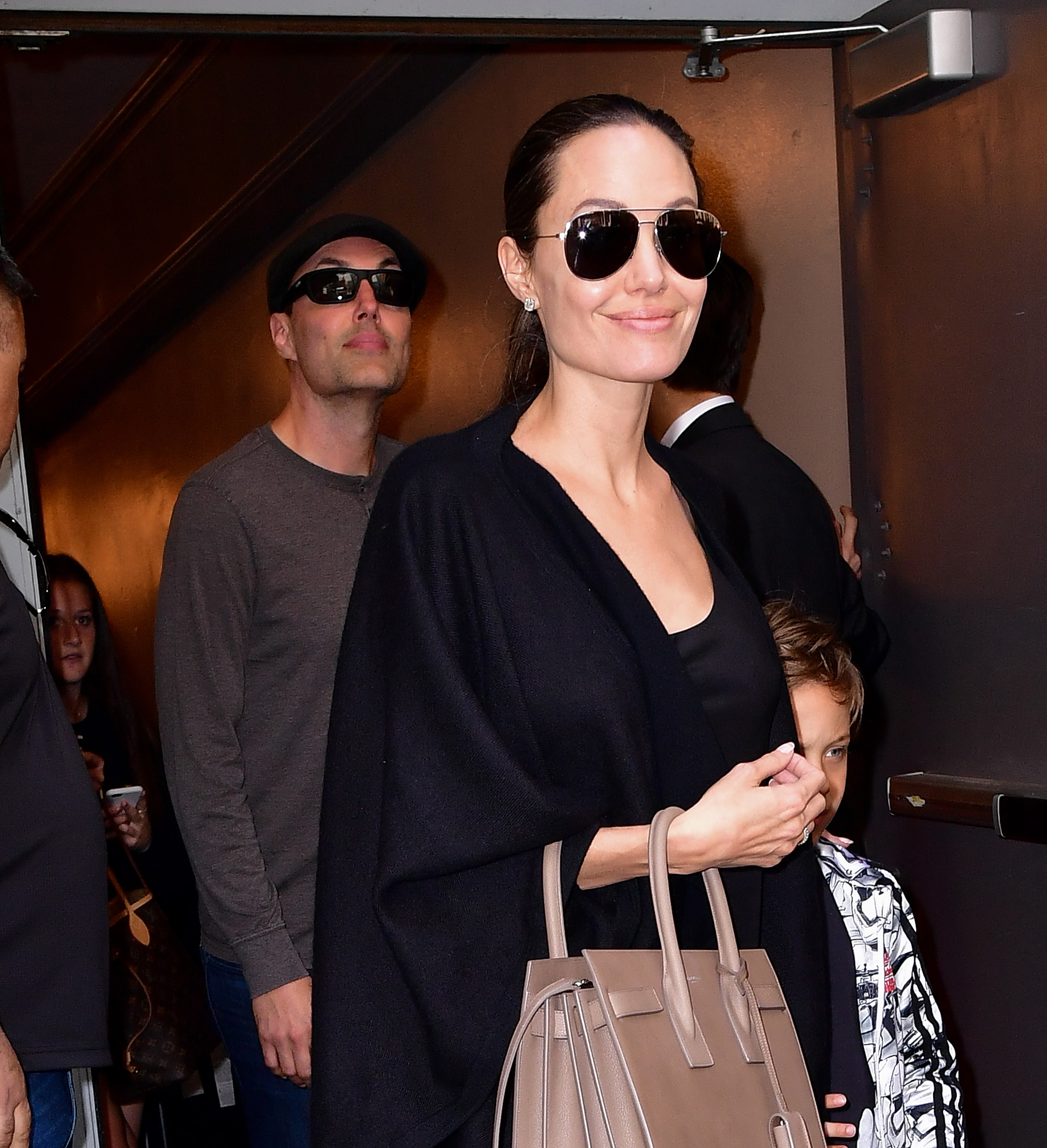 James Haven and Angelina Jolie photographed leaving Broadway musical Hamilton at Richard Rodgers Theatre on June 19, 2016, in New York. | Source: Getty Images