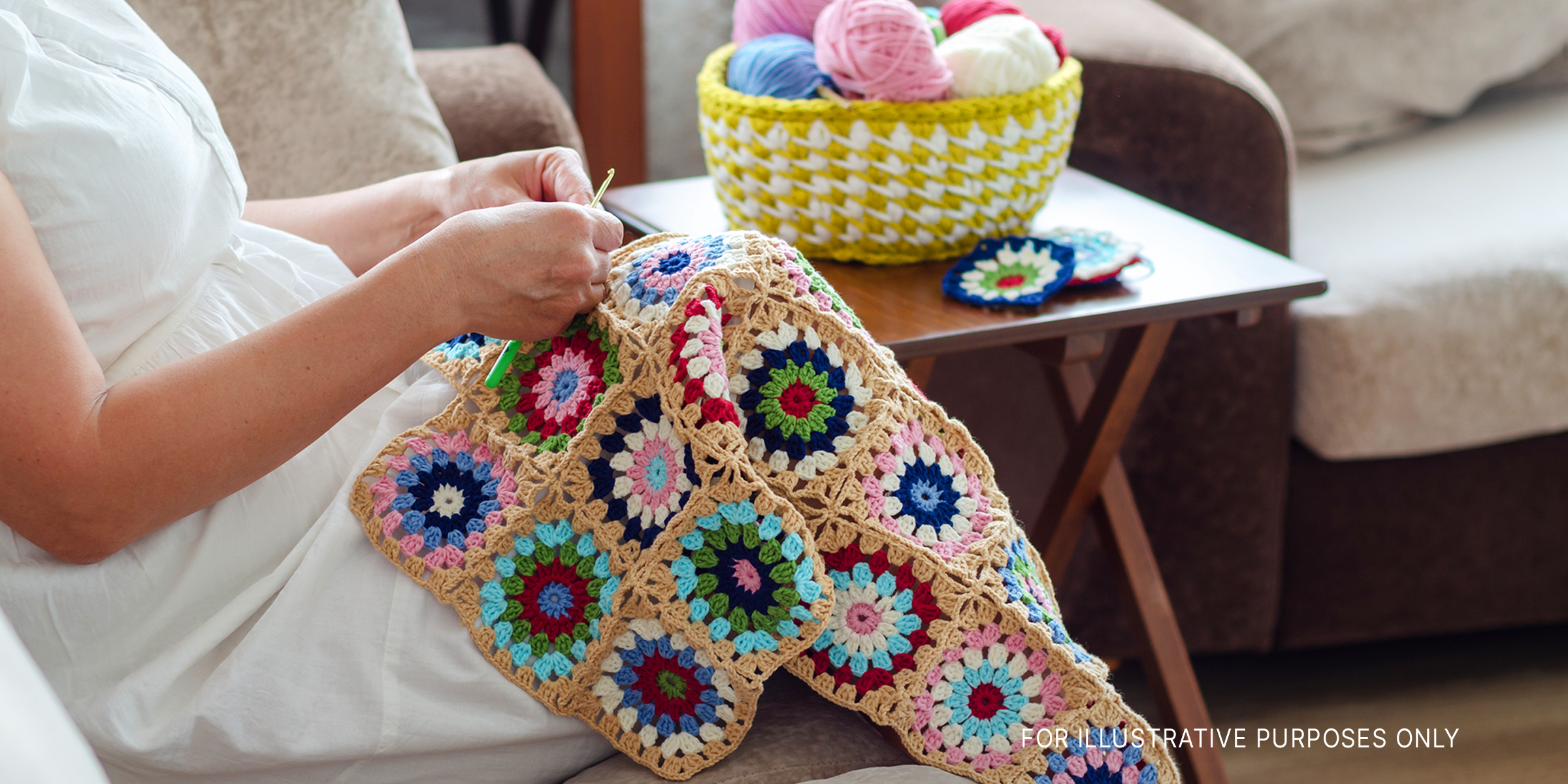 Woman crocheting a baby blanket | Source: Shutterstock